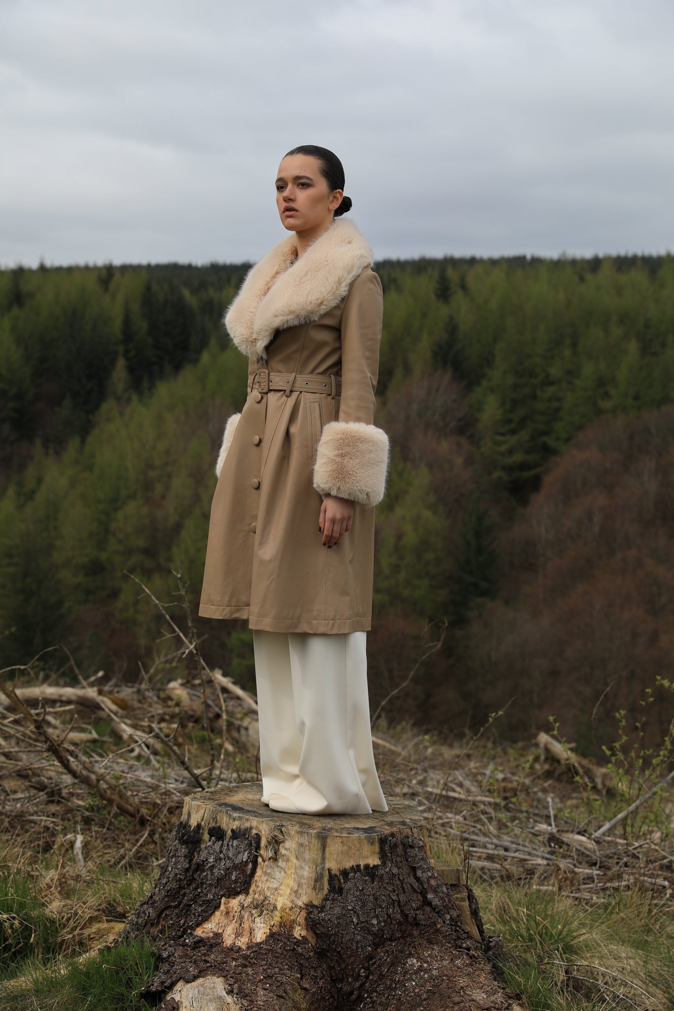 Josephine Jones' genuine leather beige trench coat featuring a faux fur collar and cuffs, exuding timeless elegance and sophisticated style.