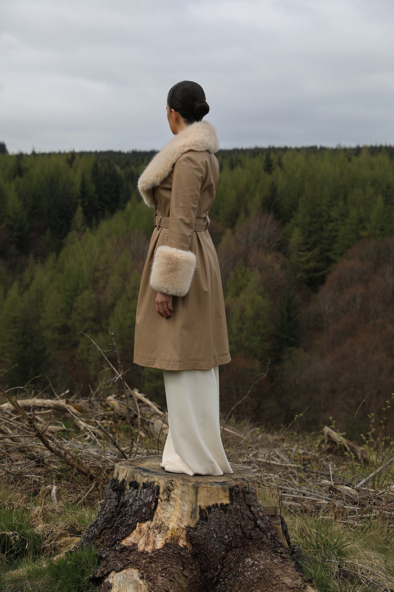 Josephine Jones' genuine leather beige trench coat featuring a faux fur collar and cuffs, exuding timeless elegance and sophisticated style.