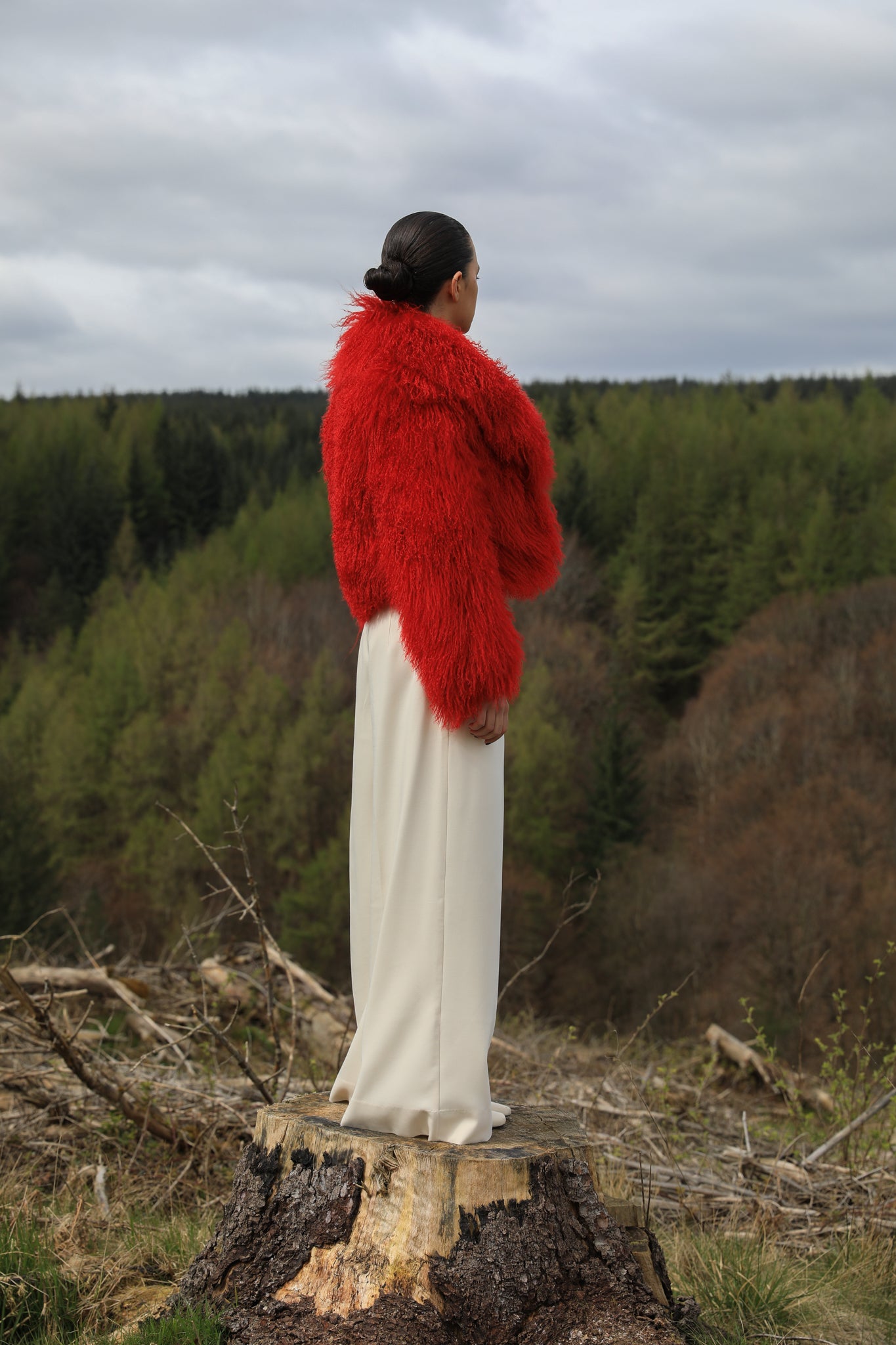 A striking red voluminous collar Mongolian fur coat from Josephine Jones, a timeless staple piece exuding elegance and luxury.