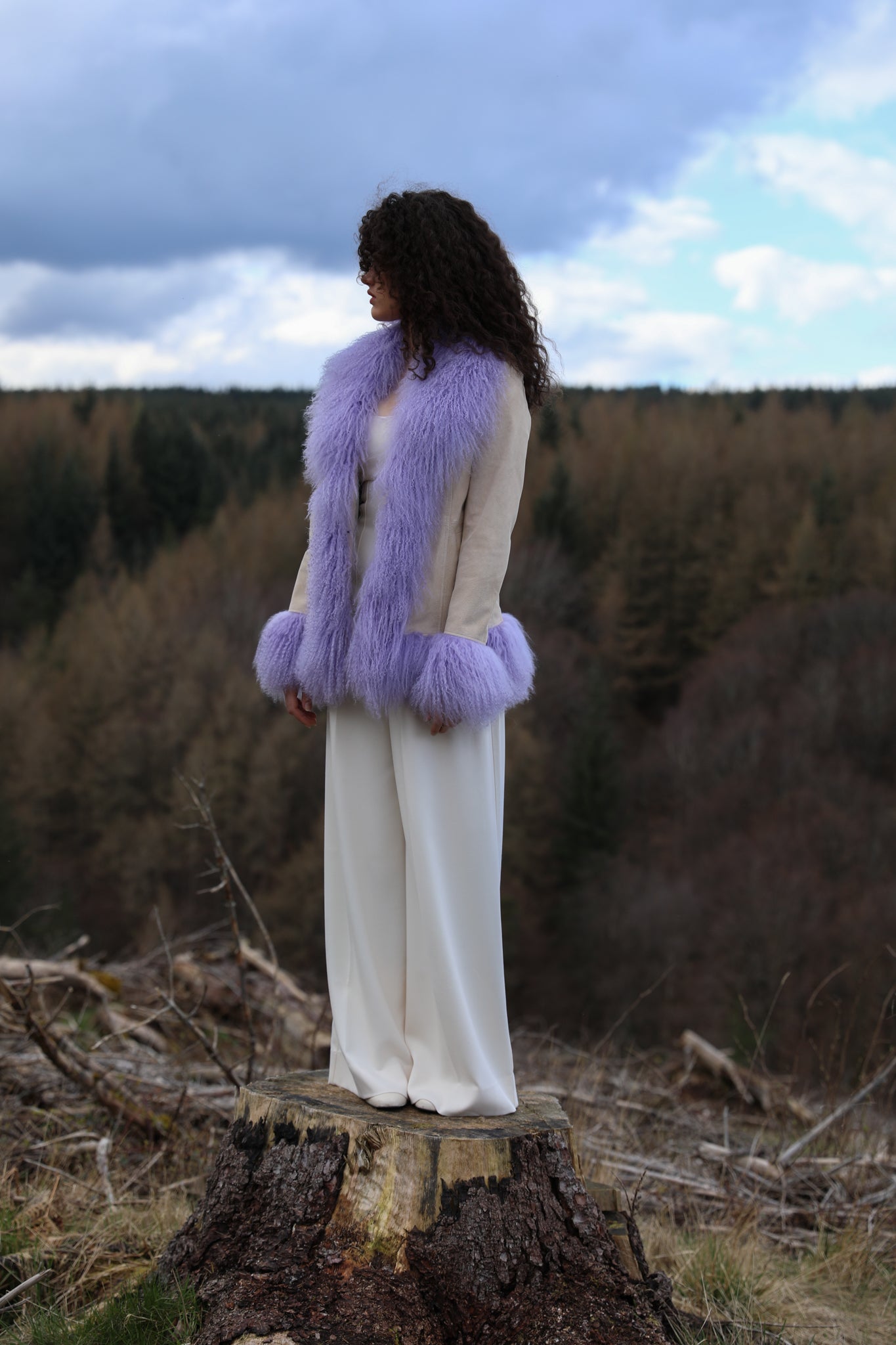 Ivory suede afghan penny lane jacket with lavender Mongolian fur trims, a timeless statement piece from Josephine Jones' collection. Luxurious, genuine suede construction adds texture and sophistication to any ensemble.