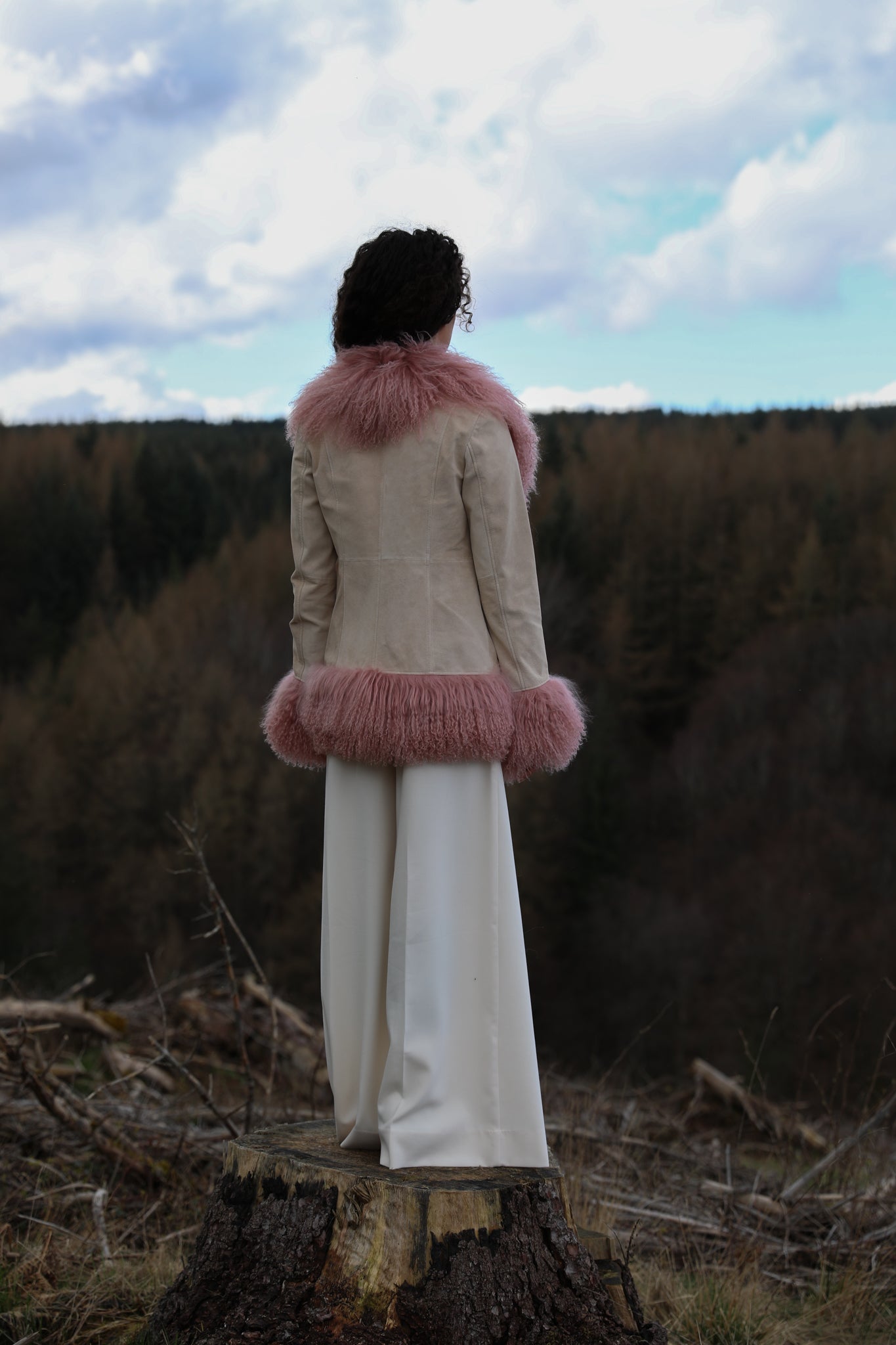 Ivory suede afghan-style jacket with blush Mongolian fur trims by Josephine Jones, epitomizing classic Penny Lane style. Luxurious genuine suede adds texture and sophistication to your wardrobe.