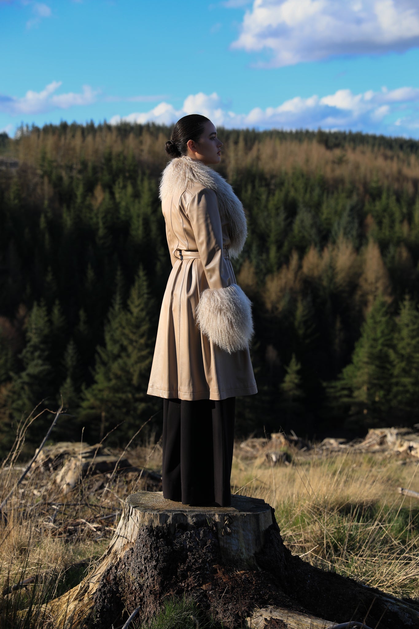 Josephine Jones beige trench coat with Mongolian collar and cuffs, crafted from genuine leather. Elevate your style with this luxurious outerwear piece.'