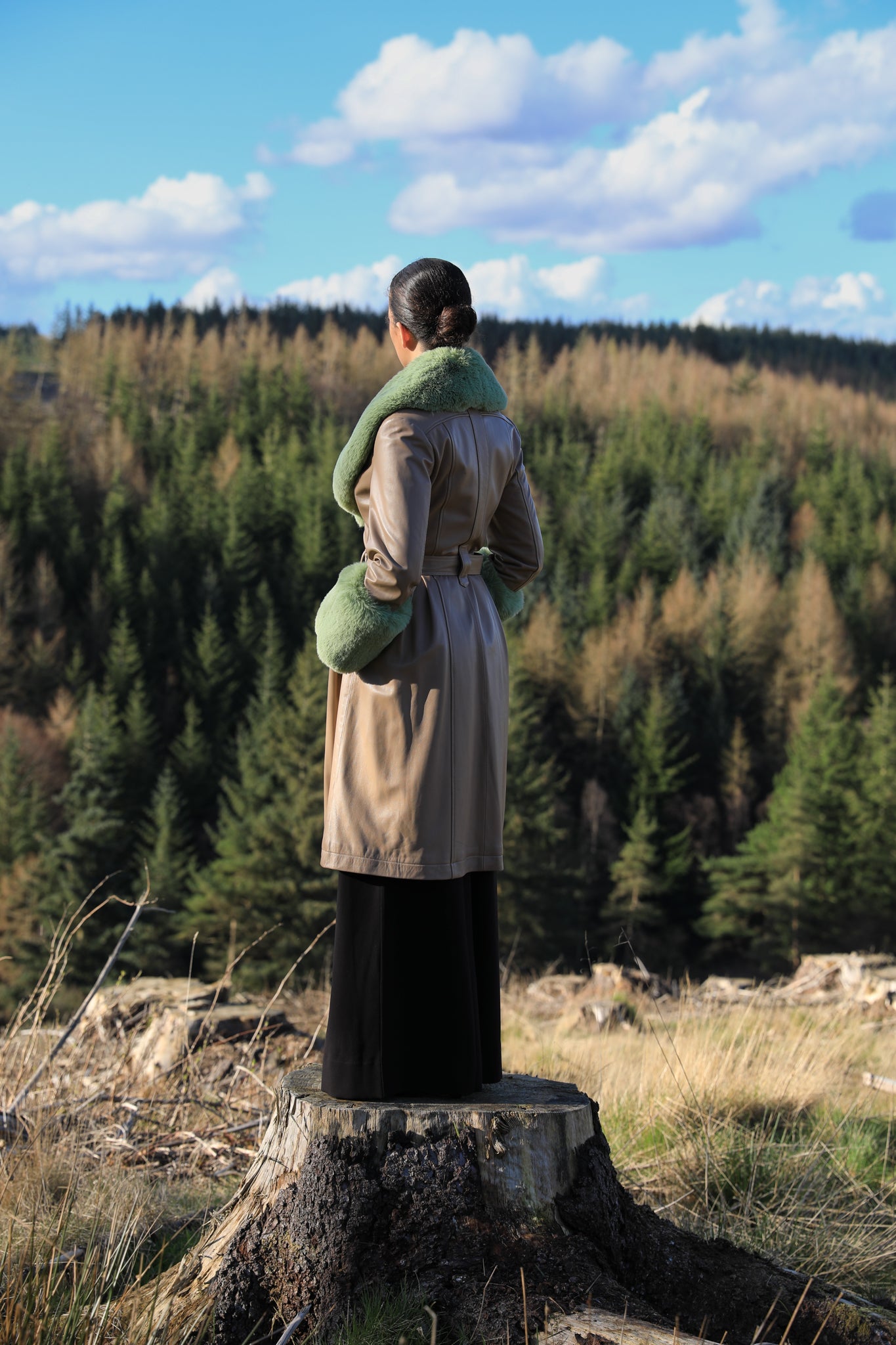 Beige trench coat with pistachio green faux fur collar and cuffs, crafted from genuine leather by Josephine Jones, offering timeless elegance and luxurious warmth for any occasion.