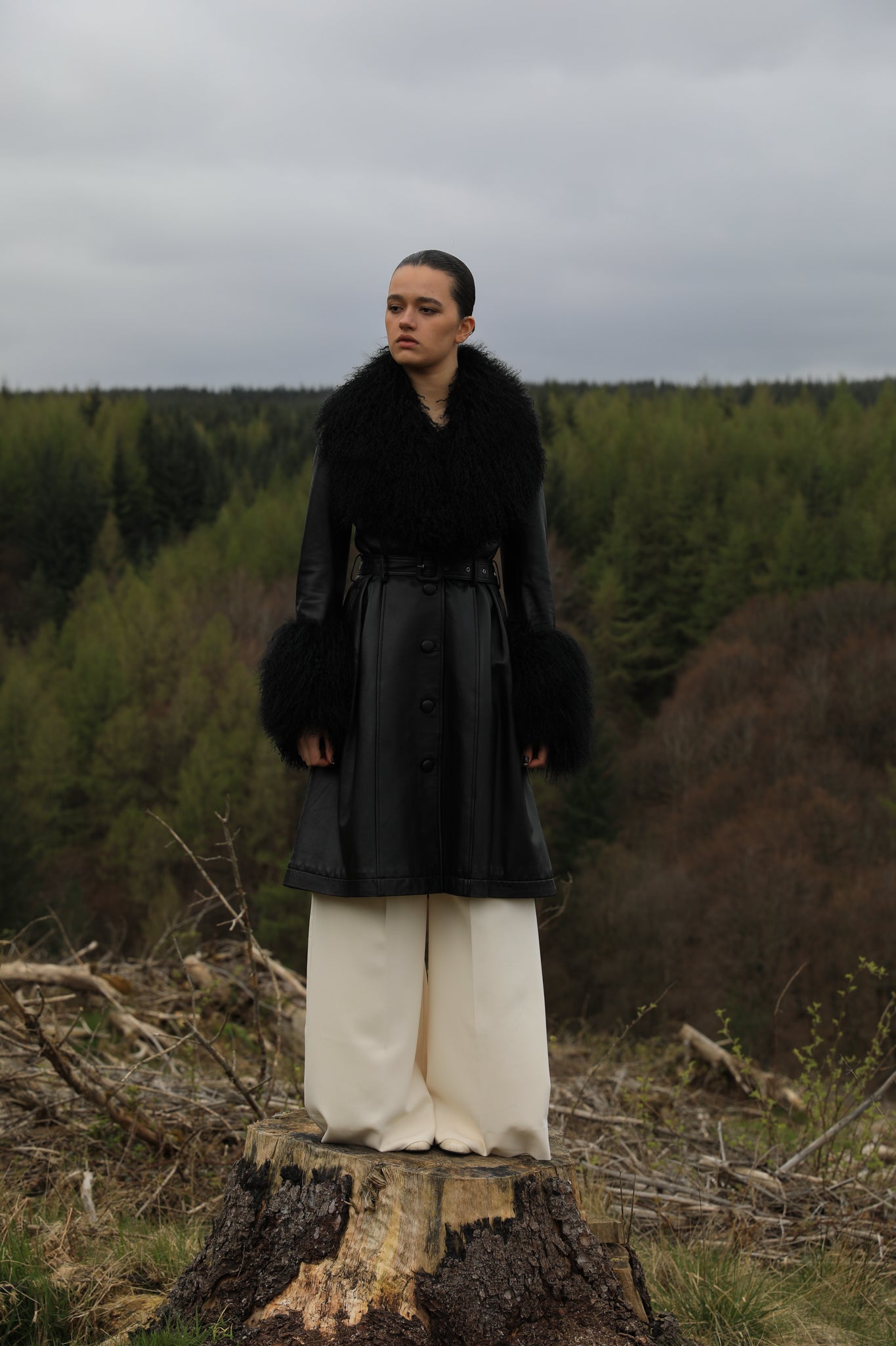 Josephine Jones genuine leather black trench coat featuring a luxurious Mongolian fur collar and cuffs. A timeless statement piece for sophisticated style.