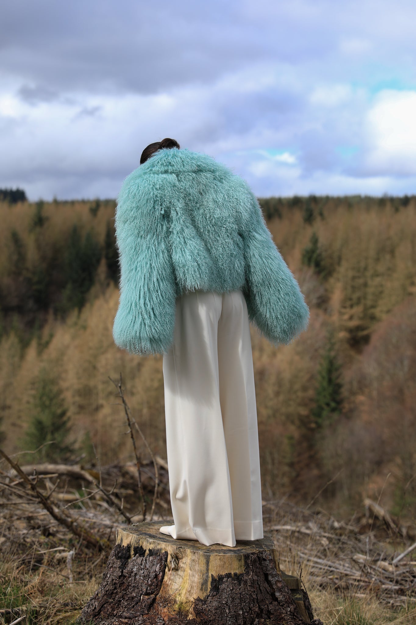 Josephine Jones' iconic mint voluminous collar Mongolian fur coat, a classic staple piece for luxurious winter fashion.