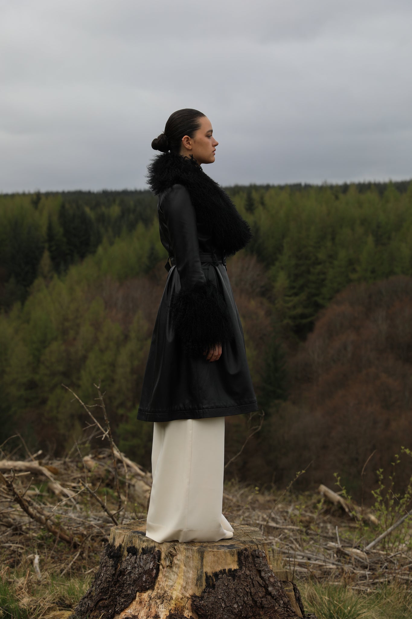 Josephine Jones genuine leather black trench coat featuring a luxurious Mongolian fur collar and cuffs. A timeless statement piece for sophisticated style.