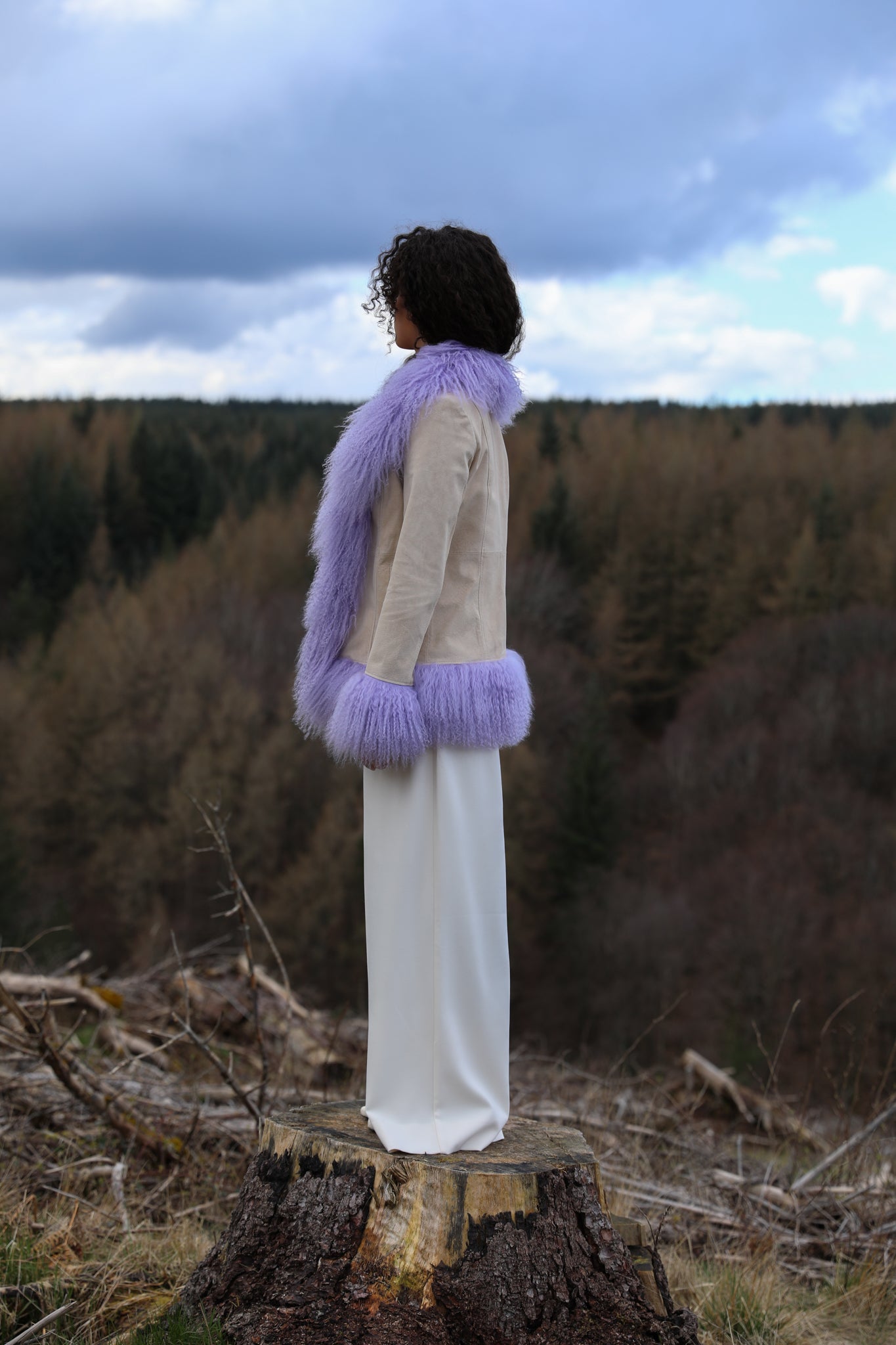 Ivory suede afghan penny lane jacket with lavender Mongolian fur trims, a timeless statement piece from Josephine Jones' collection. Luxurious, genuine suede construction adds texture and sophistication to any ensemble.