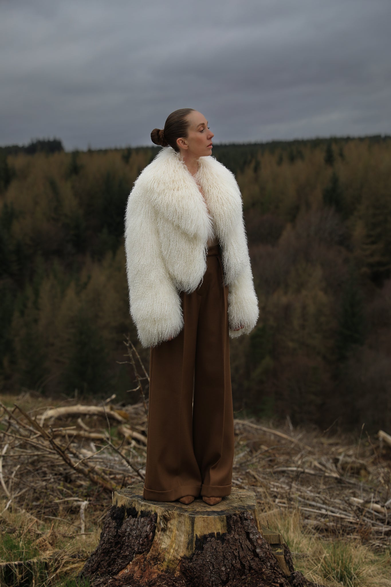 A timeless white Mongolian fur coat with a voluminous collar, the epitome of luxury and sophistication from Josephine Jones' collection.