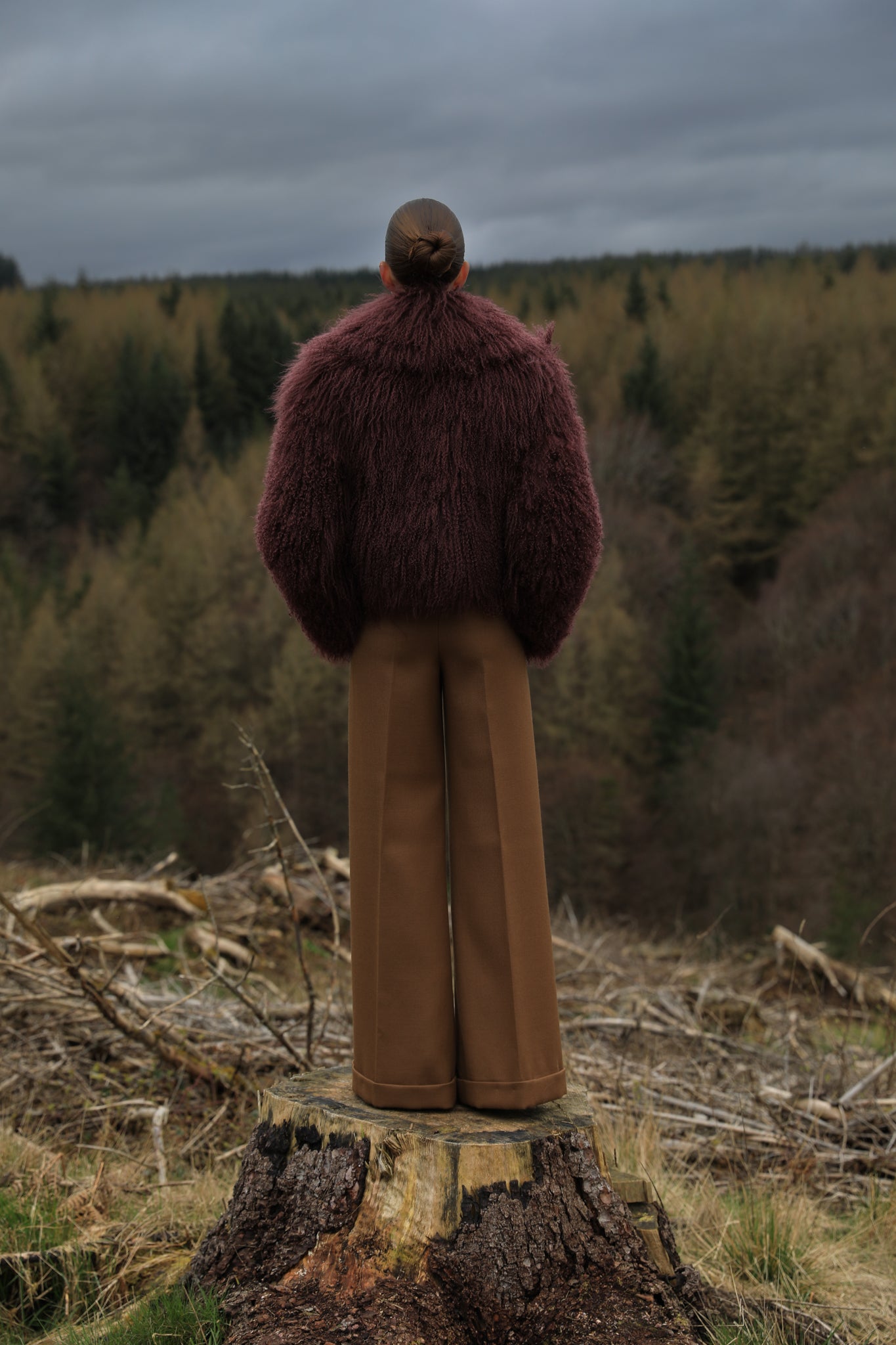  A burgundy voluminous collar Mongolian fur coat from Josephine Jones, a classic staple piece exuding elegance and luxury.