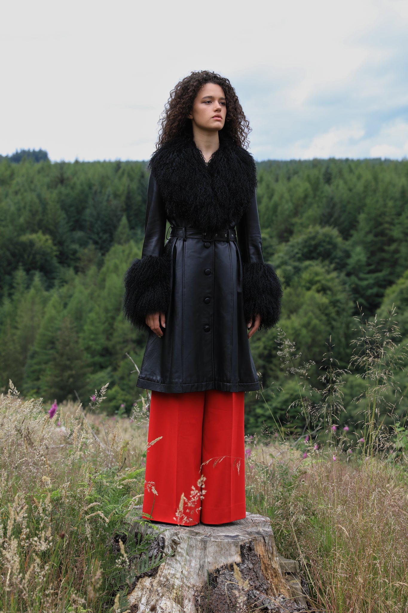 Josephine Jones genuine leather black trench coat featuring a luxurious Mongolian fur collar and cuffs. A timeless statement piece for sophisticated style.