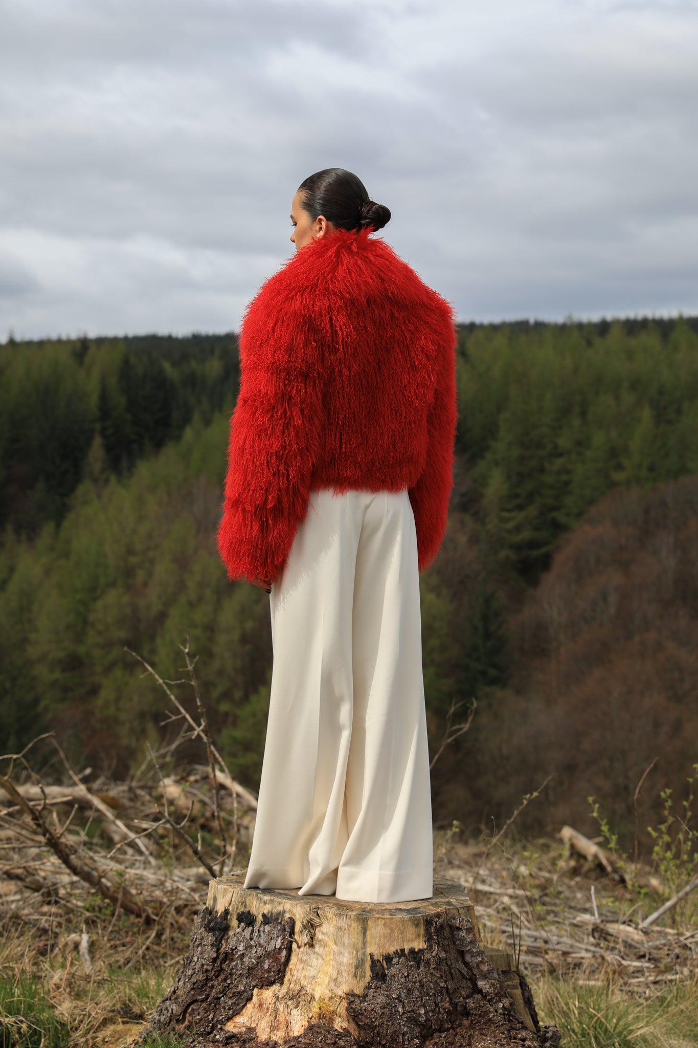 A striking red voluminous collar Mongolian fur coat from Josephine Jones, a timeless staple piece exuding elegance and luxury.