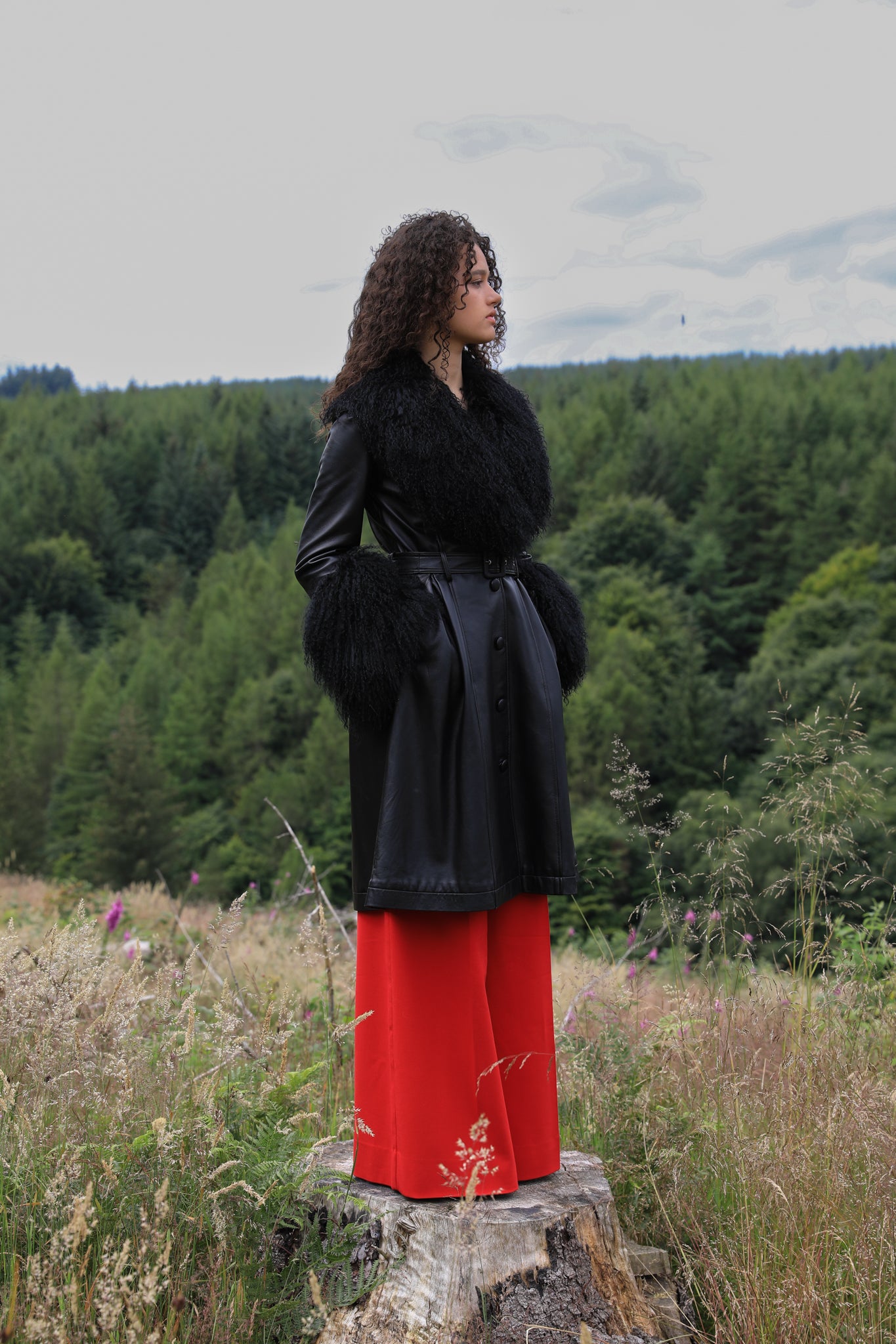 Josephine Jones genuine leather black trench coat featuring a luxurious Mongolian fur collar and cuffs. A timeless statement piece for sophisticated style.