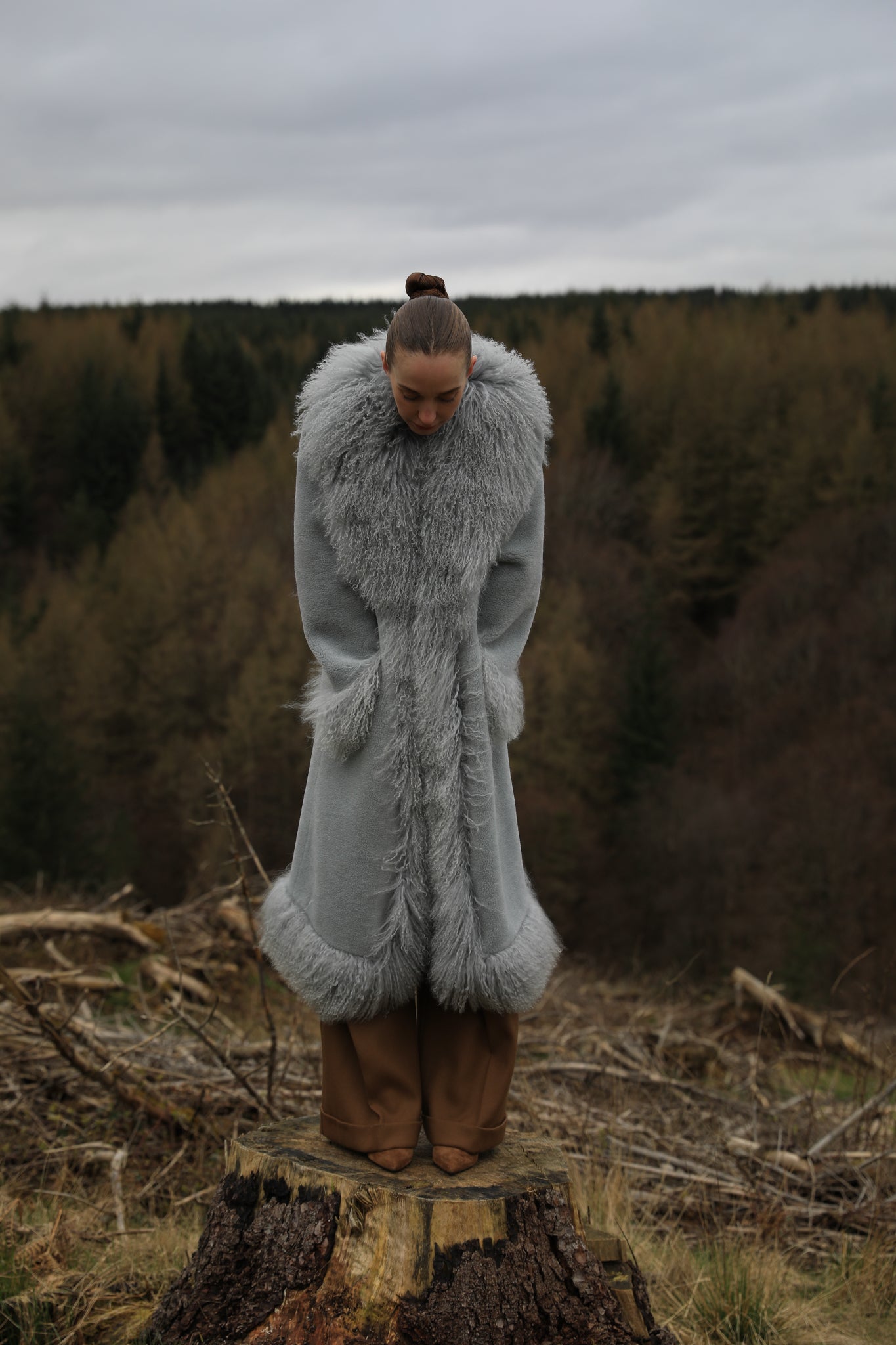 Josephine Jones bestselling long genuine shearling coat in grey, featuring exquisite Mongolian fur trims. Elevate your winter style with this luxurious outerwear essential.