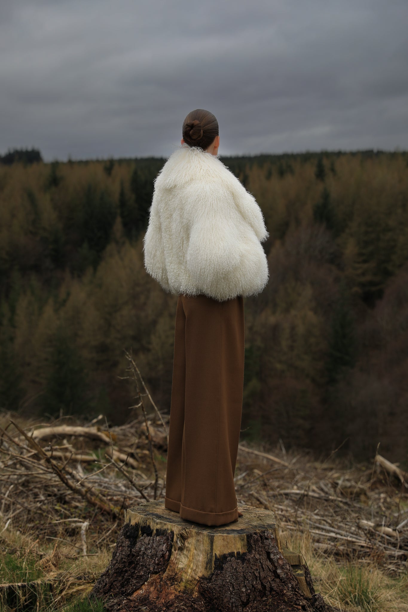 A timeless white Mongolian fur coat with a voluminous collar, the epitome of luxury and sophistication from Josephine Jones' collection.