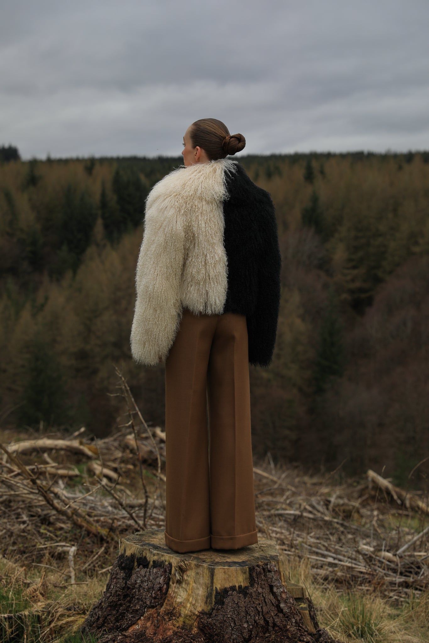 Josephine Jones' iconic Mongolian fur coat, showcasing a voluminous collar with a striking half-ivory, half-black design. A timeless statement piece for any wardrobe.