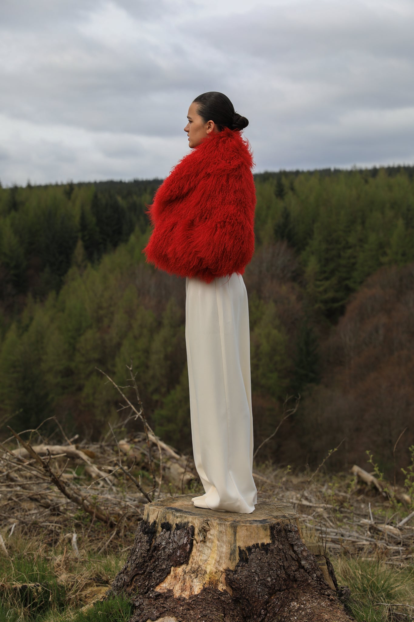 A striking red voluminous collar Mongolian fur coat from Josephine Jones, a timeless staple piece exuding elegance and luxury.