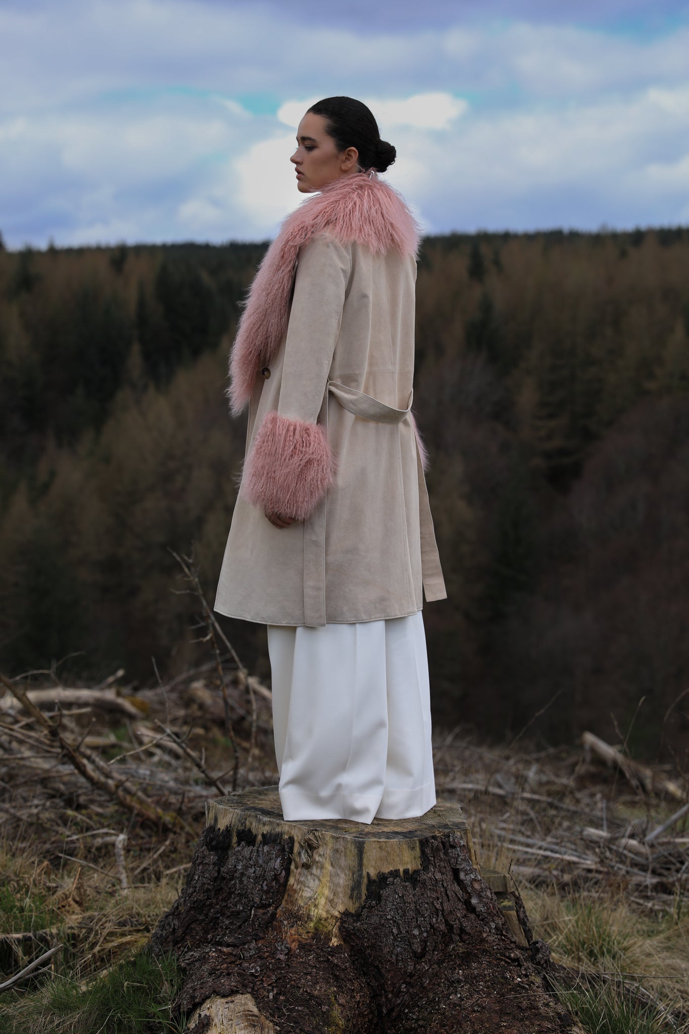 Ivory genuine suede trench wrap coat with blush Mongolian collar and cuffs, designed by Josephine Jones. Luxuriously crafted outerwear perfect for adding elegance to any ensemble.