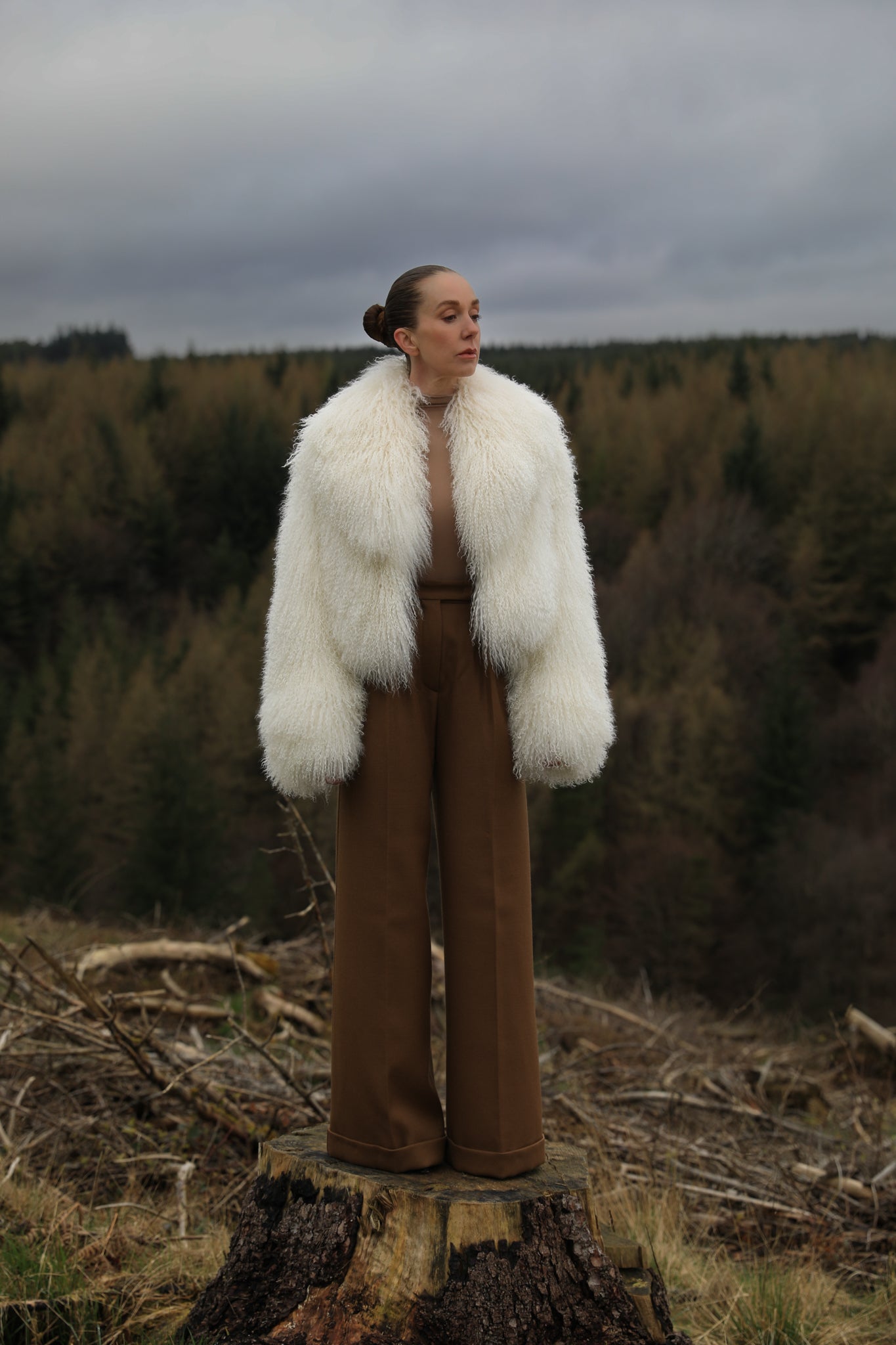 A timeless white Mongolian fur coat with a voluminous collar, the epitome of luxury and sophistication from Josephine Jones' collection.