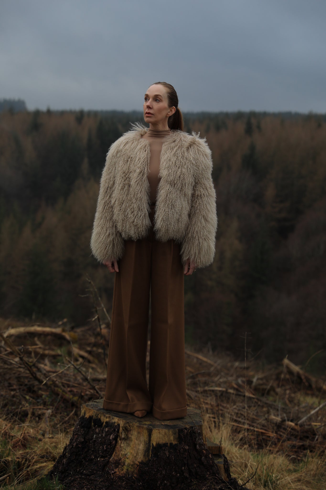 A sophisticated beige Mongolian fur coat from Josephine Jones, exuding elegance and warmth, perfect for adding a touch of luxury to any outfit.