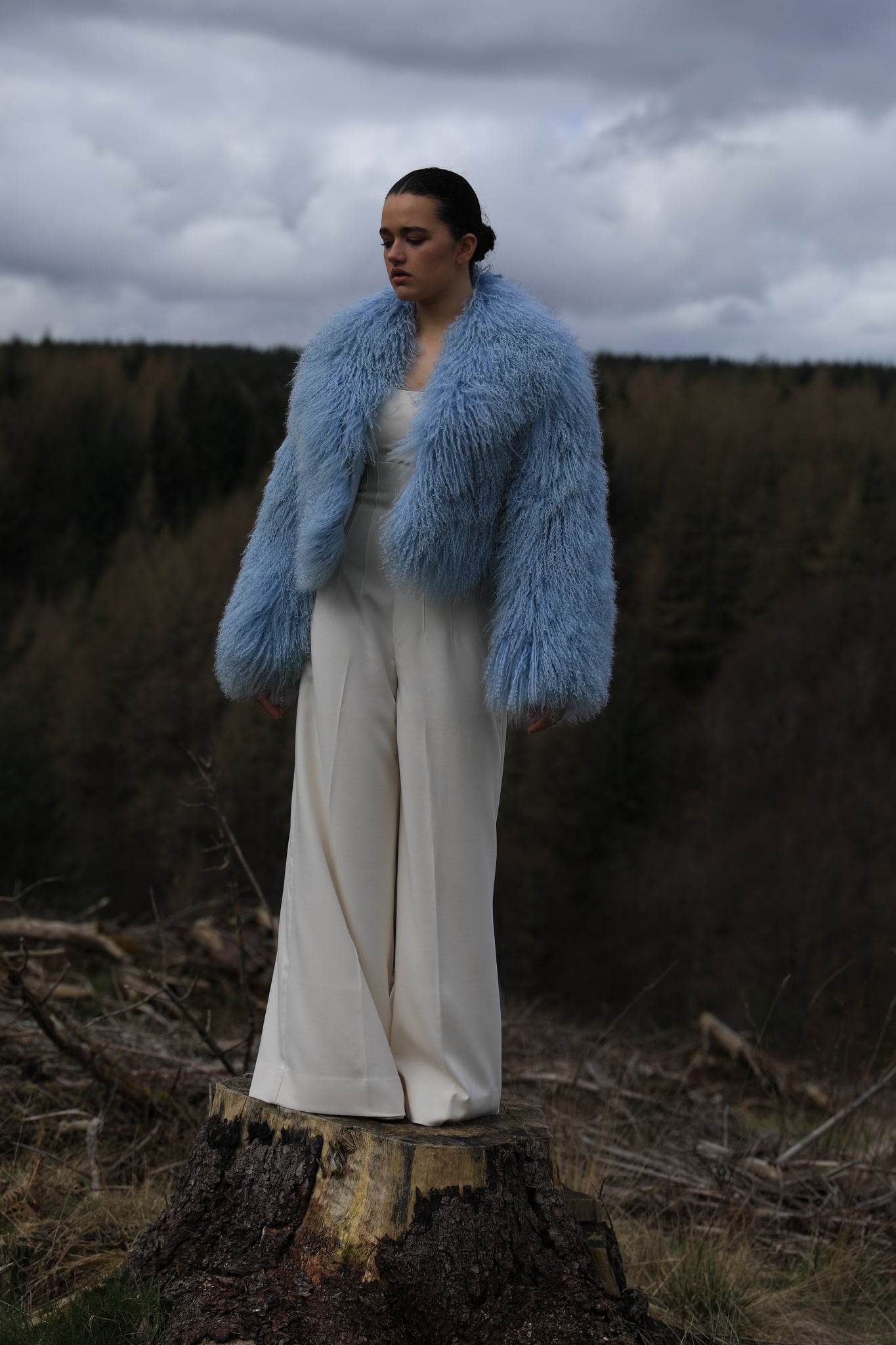 A stunning blue voluminous collar Mongolian fur coat by Josephine Jones, a timeless staple piece exuding elegance and luxury.