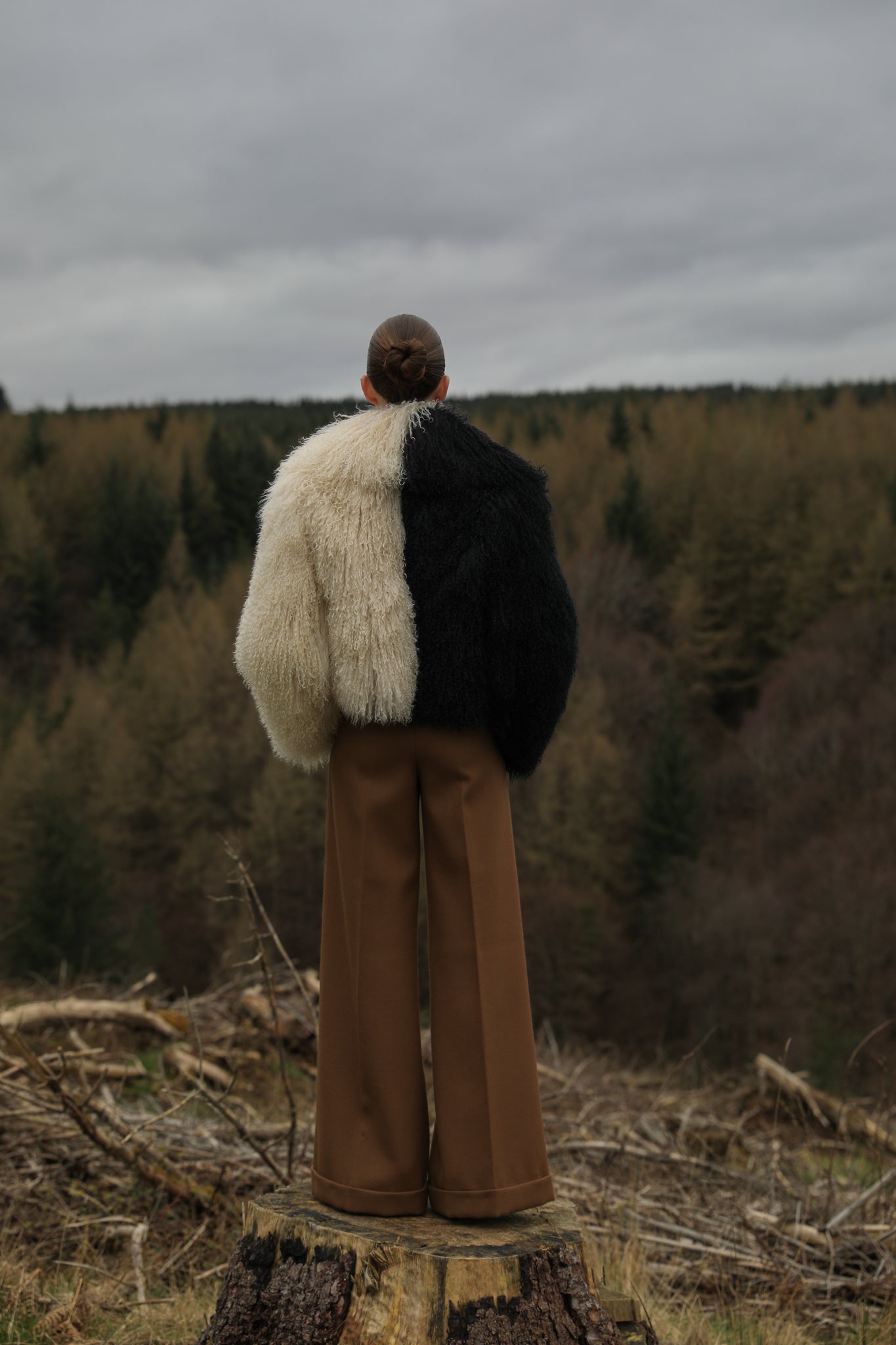 Josephine Jones' iconic Mongolian fur coat, showcasing a voluminous collar with a striking half-ivory, half-black design. A timeless statement piece for any wardrobe.