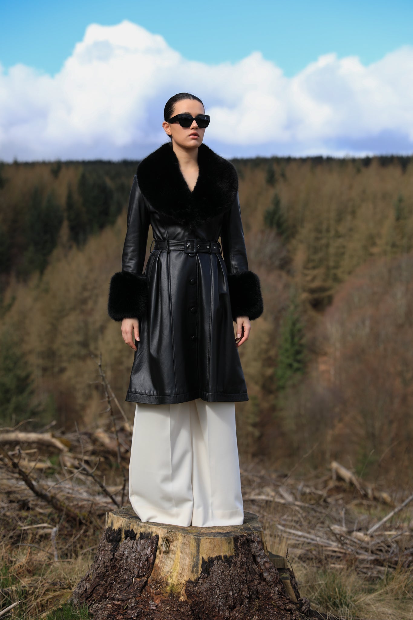 Josephine Jones genuine leather black trench coat with faux fur collar and cuffs, a timeless statement piece for any occasion.