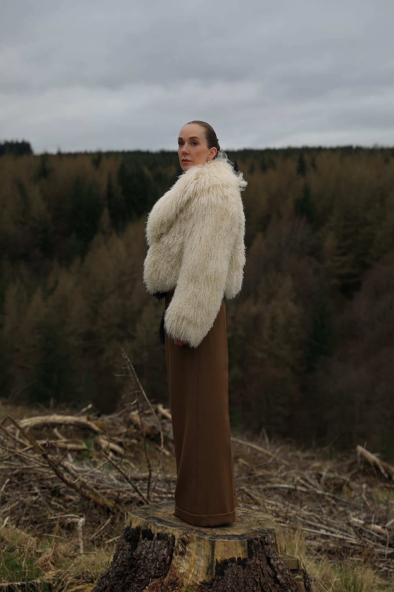 Josephine Jones' iconic Mongolian fur coat, showcasing a voluminous collar with a striking half-ivory, half-black design. A timeless statement piece for any wardrobe.