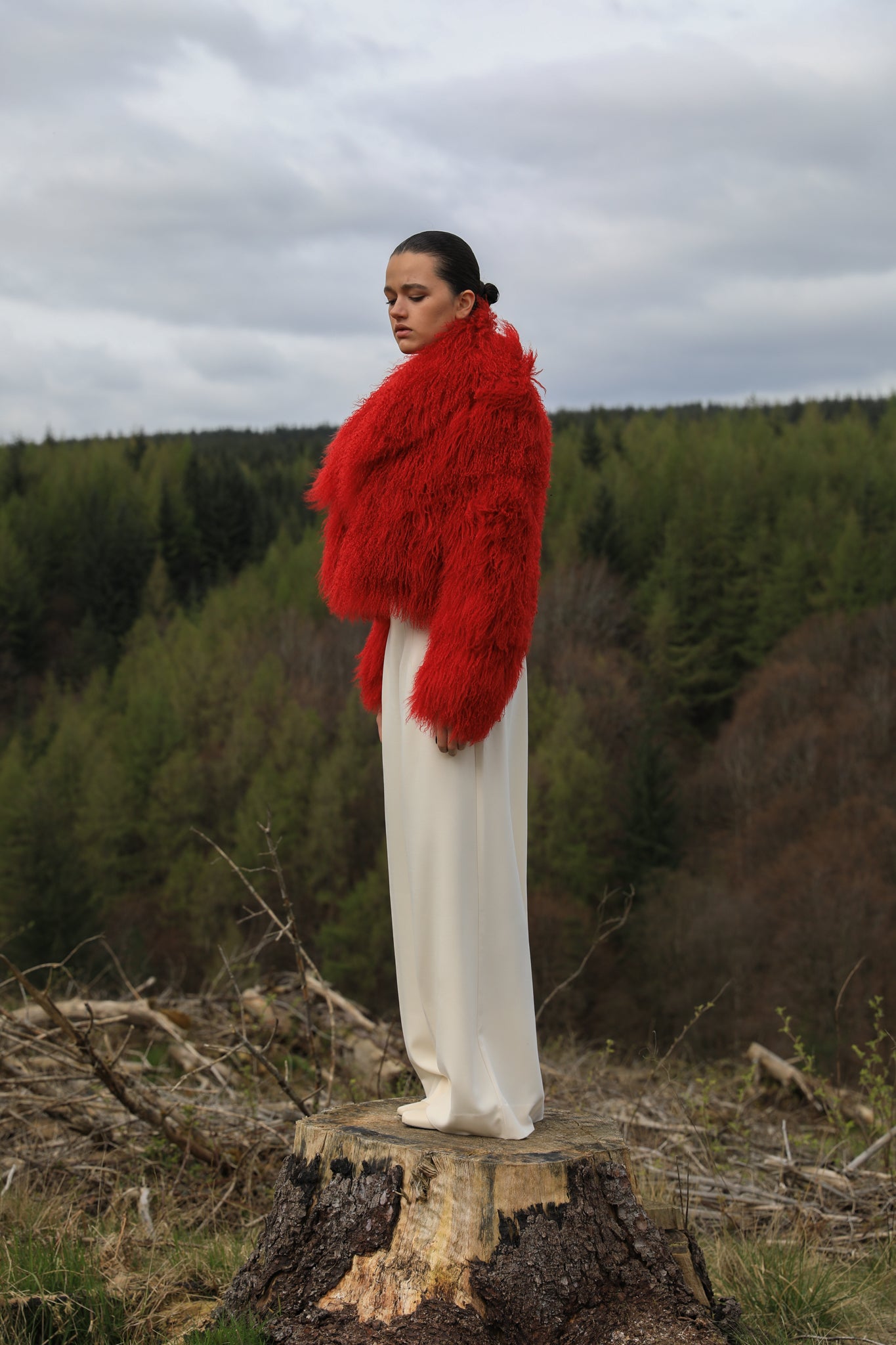 A striking red voluminous collar Mongolian fur coat from Josephine Jones, a timeless staple piece exuding elegance and luxury.