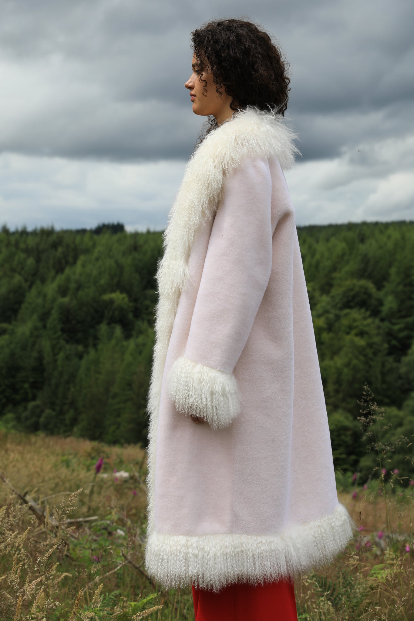 Josephine Jones Buttermint Genuine Shearling Coat with Mongolian Fur Trims - Longline silhouette, luxurious shearling fabric in a soft buttermint hue, adorned with elegant Mongolian fur trims. Perfect blend of style and warmth for the fashion-forward individual.