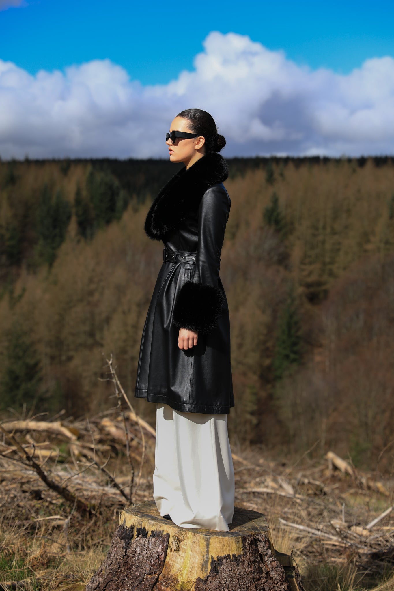 Josephine Jones genuine leather black trench coat with faux fur collar and cuffs, a timeless statement piece for any occasion.