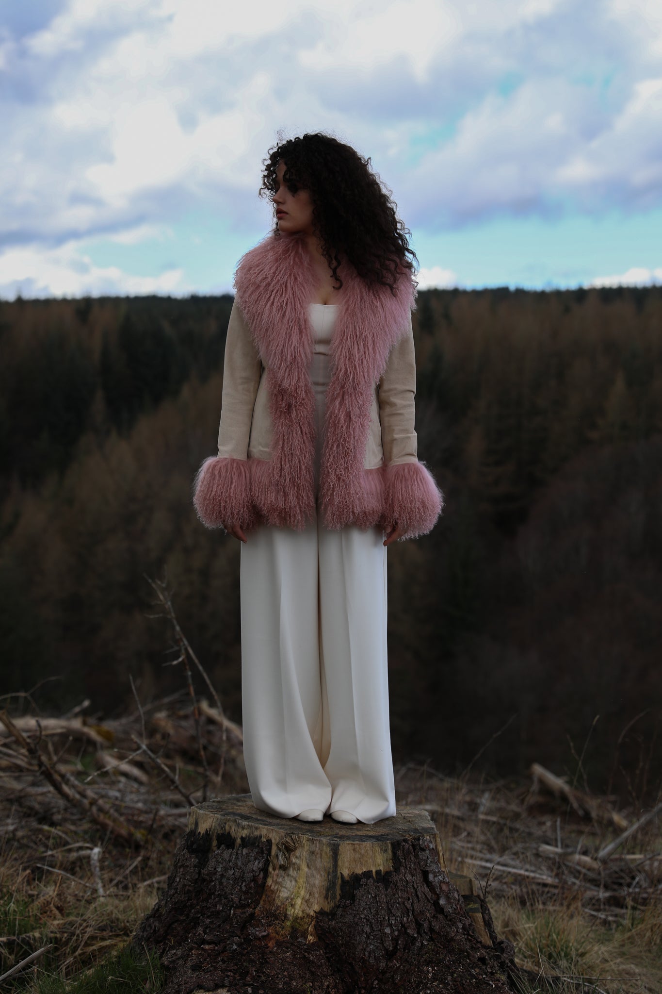 Ivory suede afghan-style jacket with blush Mongolian fur trims by Josephine Jones, epitomizing classic Penny Lane style. Luxurious genuine suede adds texture and sophistication to your wardrobe.