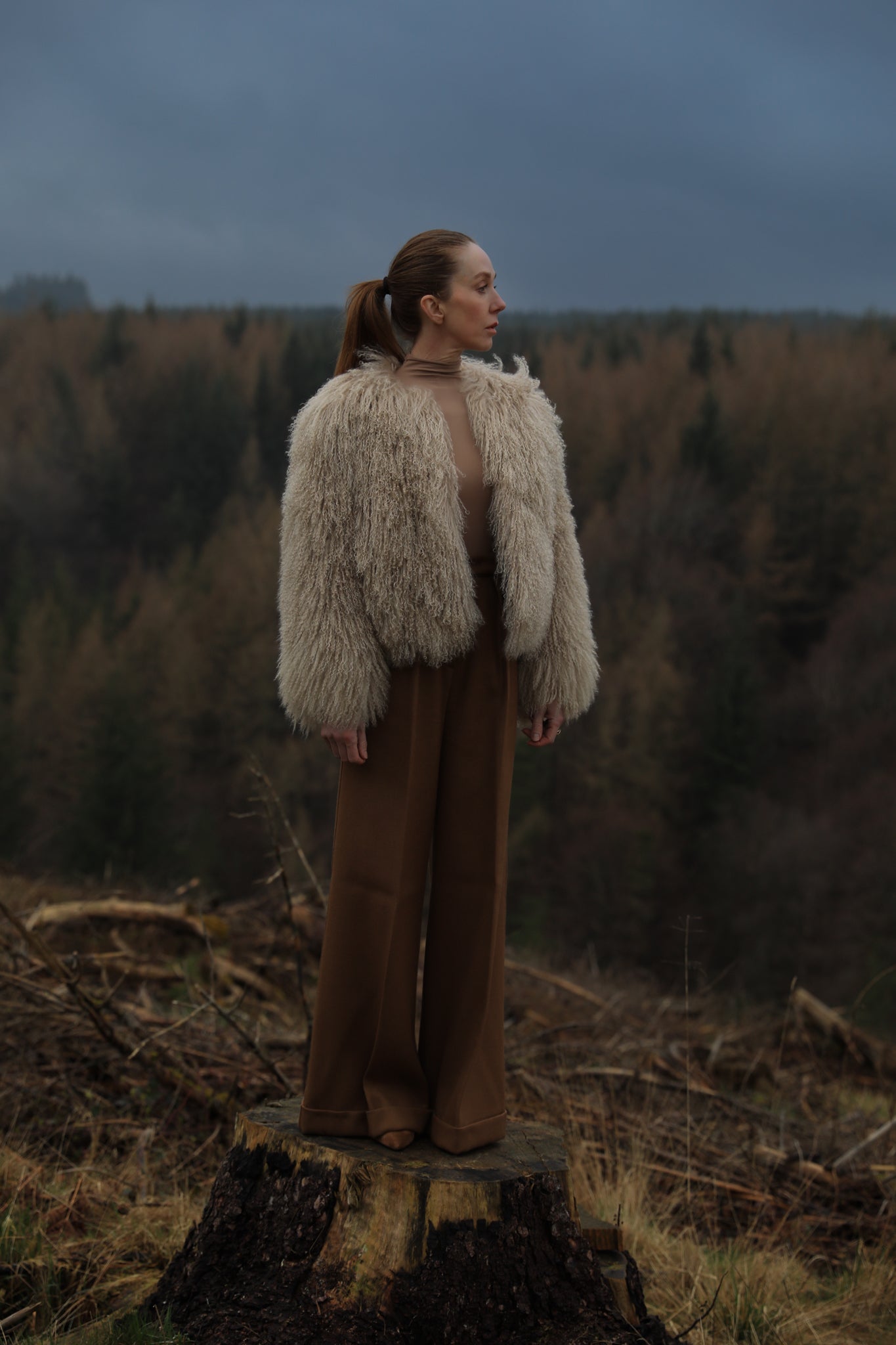 A sophisticated beige Mongolian fur coat from Josephine Jones, exuding elegance and warmth, perfect for adding a touch of luxury to any outfit.