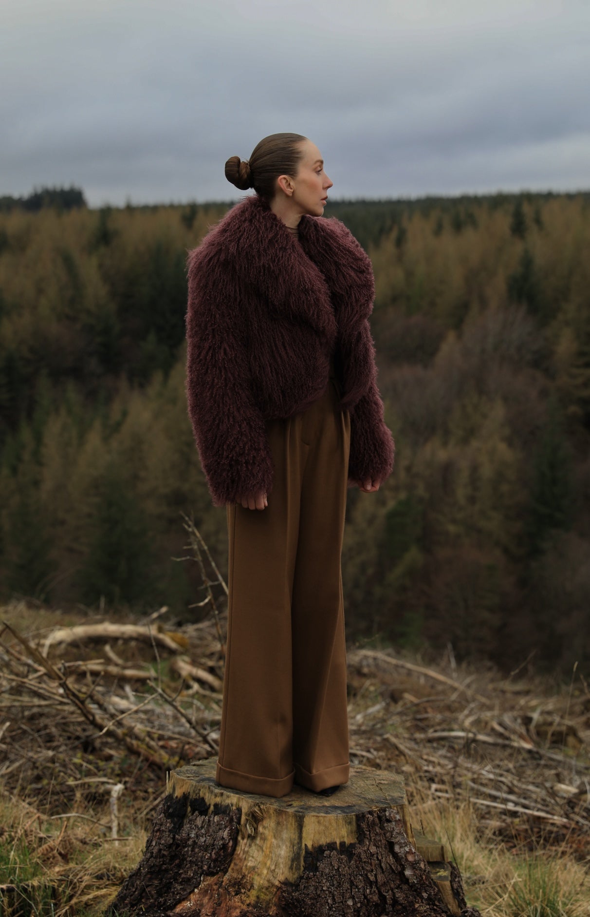  A burgundy voluminous collar Mongolian fur coat from Josephine Jones, a classic staple piece exuding elegance and luxury.