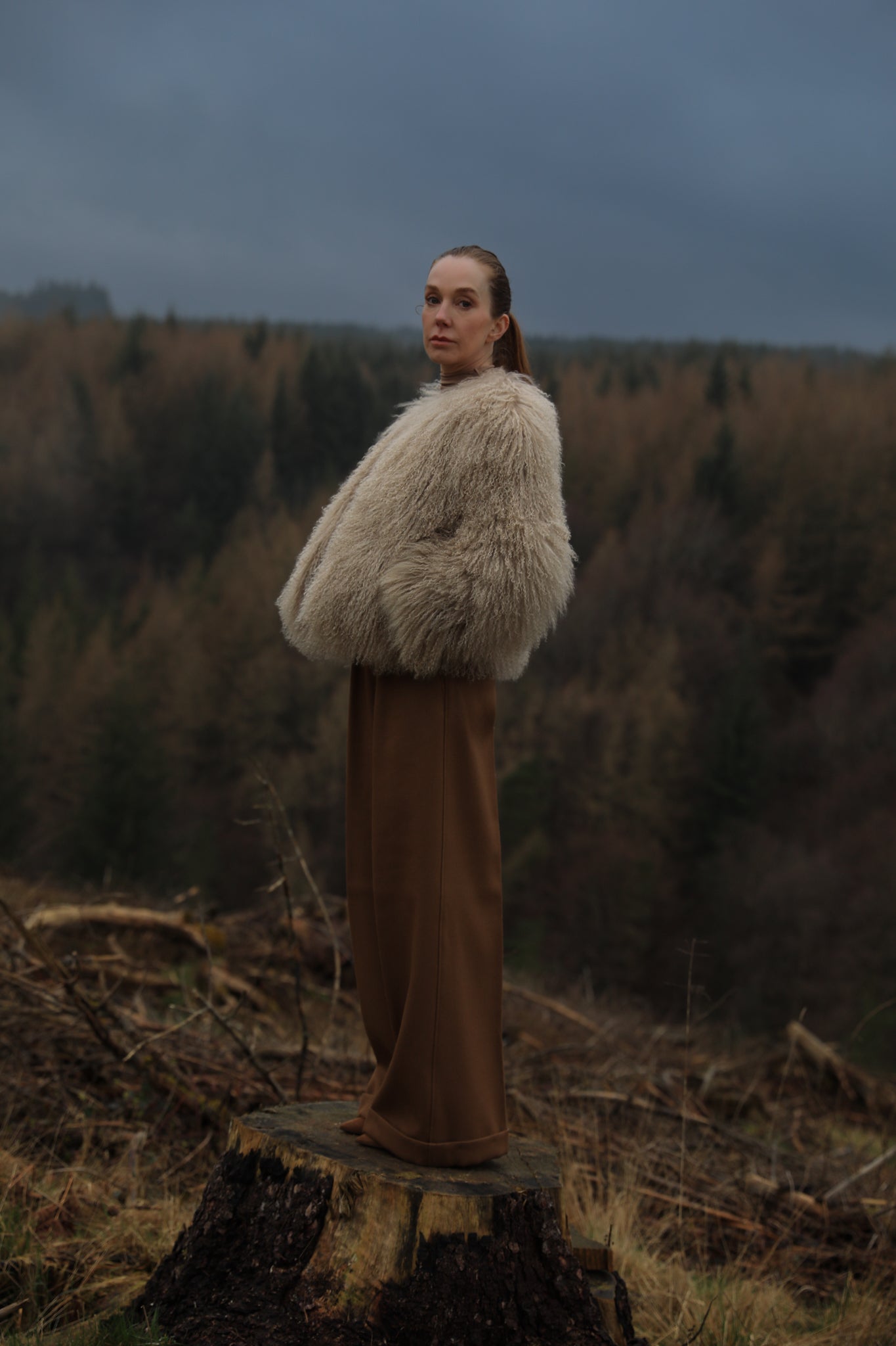 A sophisticated beige Mongolian fur coat from Josephine Jones, exuding elegance and warmth, perfect for adding a touch of luxury to any outfit.