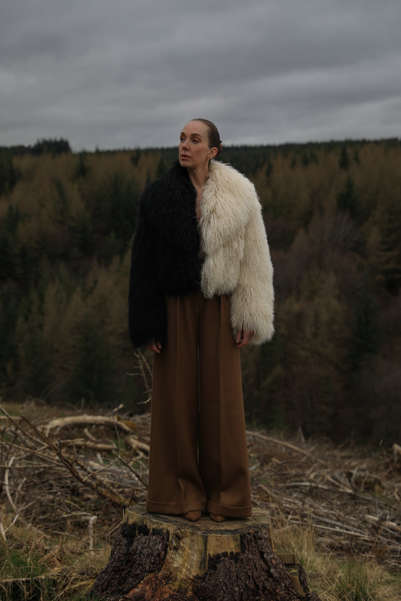 Josephine Jones' iconic Mongolian fur coat, showcasing a voluminous collar with a striking half-ivory, half-black design. A timeless statement piece for any wardrobe.