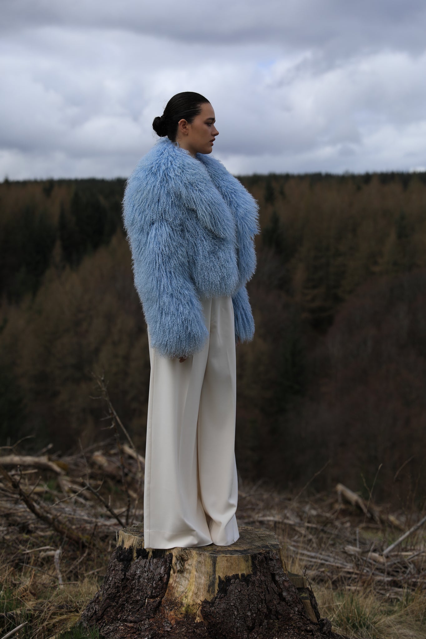 A stunning blue voluminous collar Mongolian fur coat by Josephine Jones, a timeless staple piece exuding elegance and luxury.