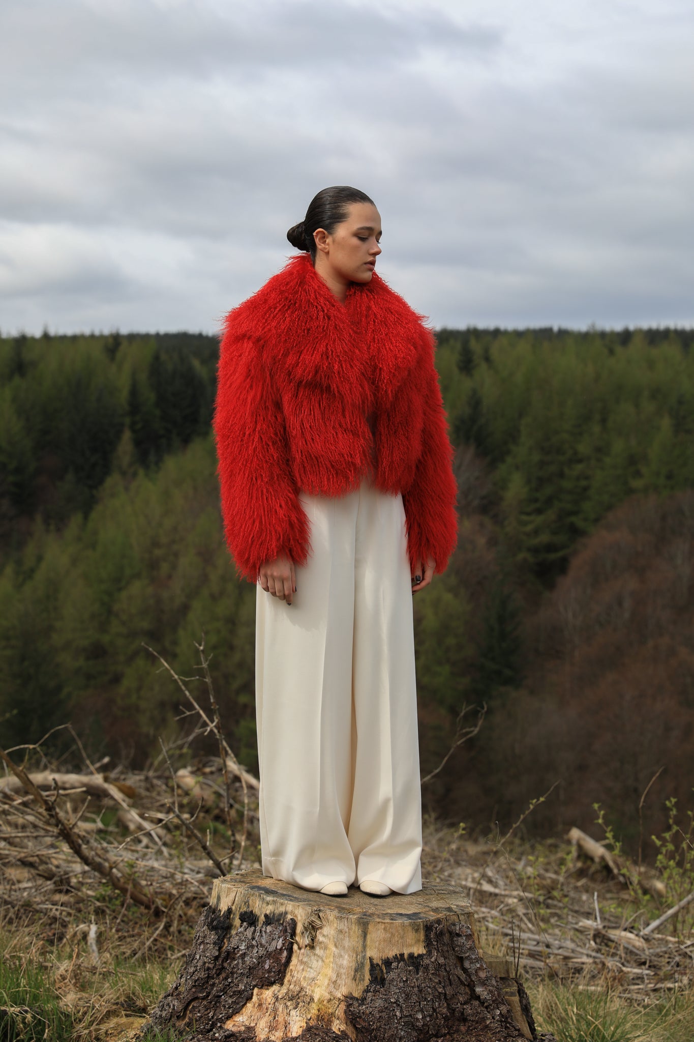 A striking red voluminous collar Mongolian fur coat from Josephine Jones, a timeless staple piece exuding elegance and luxury.