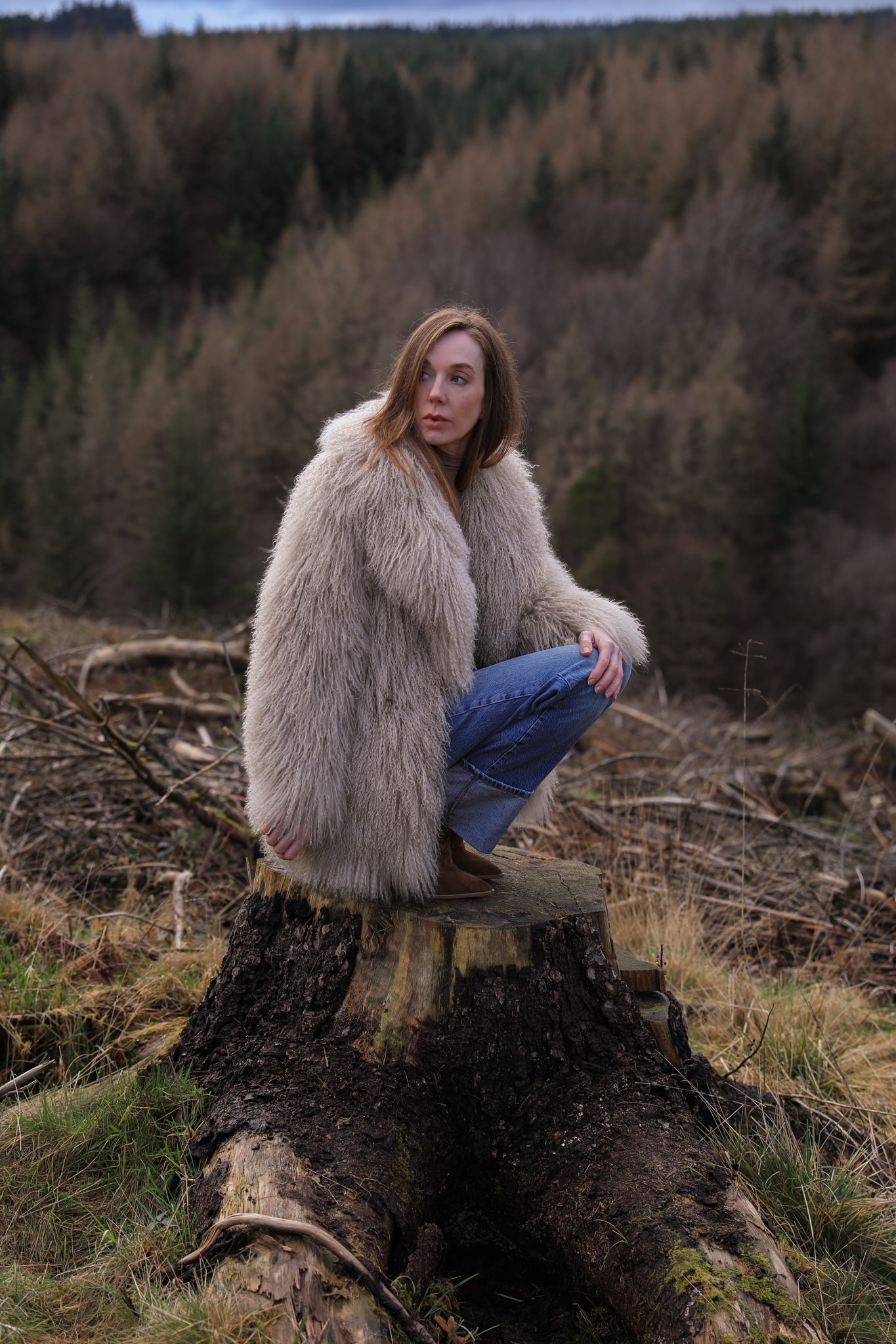 Beige Mongolian fur mid-length coat from Josephine Jones. This luxurious coat features soft fur with a mid-length design, perfect for adding elegance and warmth to any outfit.