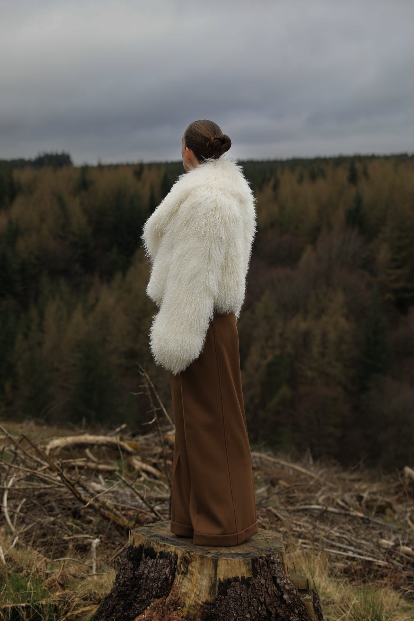 A timeless white Mongolian fur coat with a voluminous collar, the epitome of luxury and sophistication from Josephine Jones' collection.