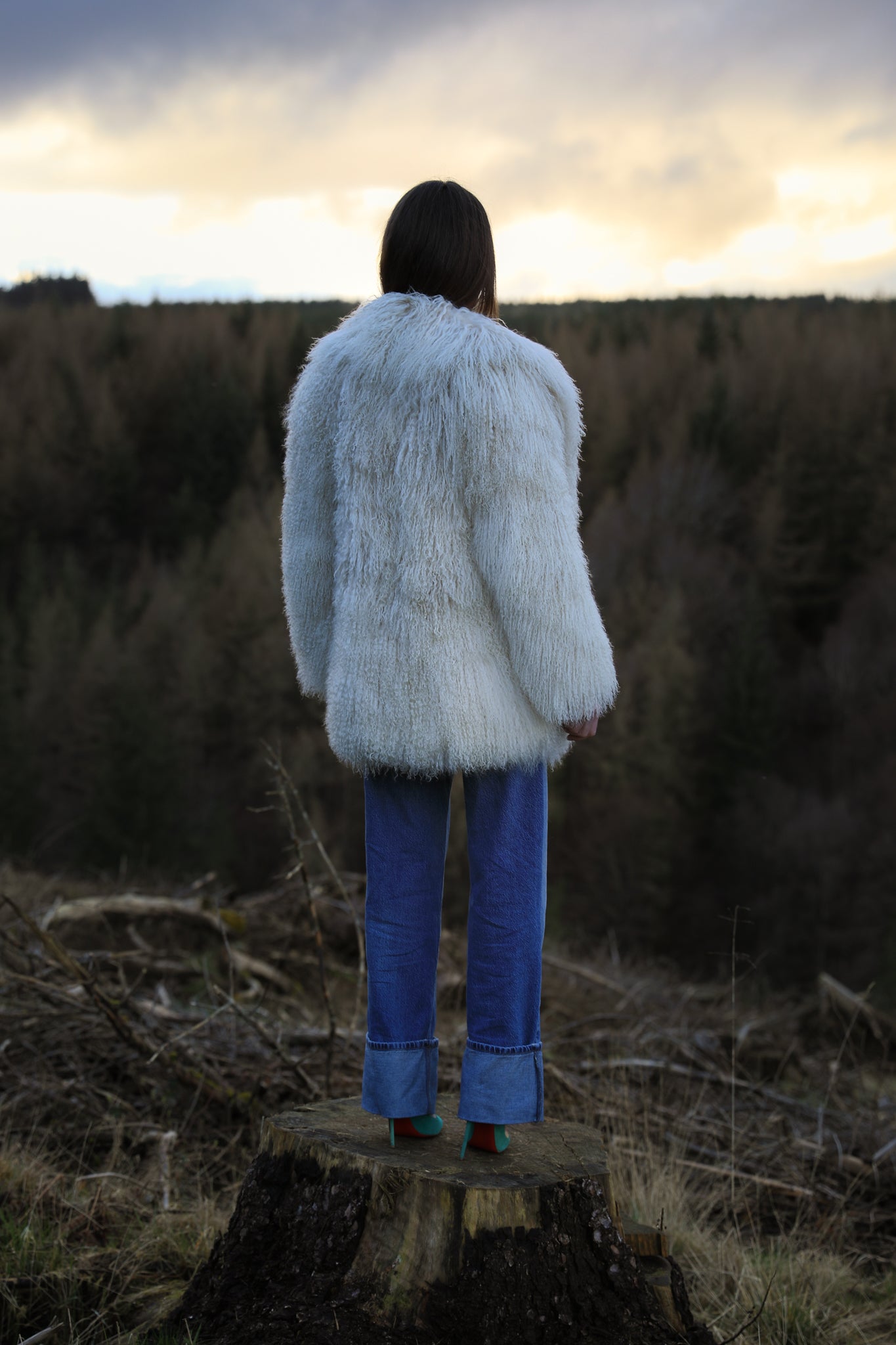 Ivory Mongolian fur mid-length coat from Josephine Jones, offering timeless elegance and luxurious warmth for any occasion.