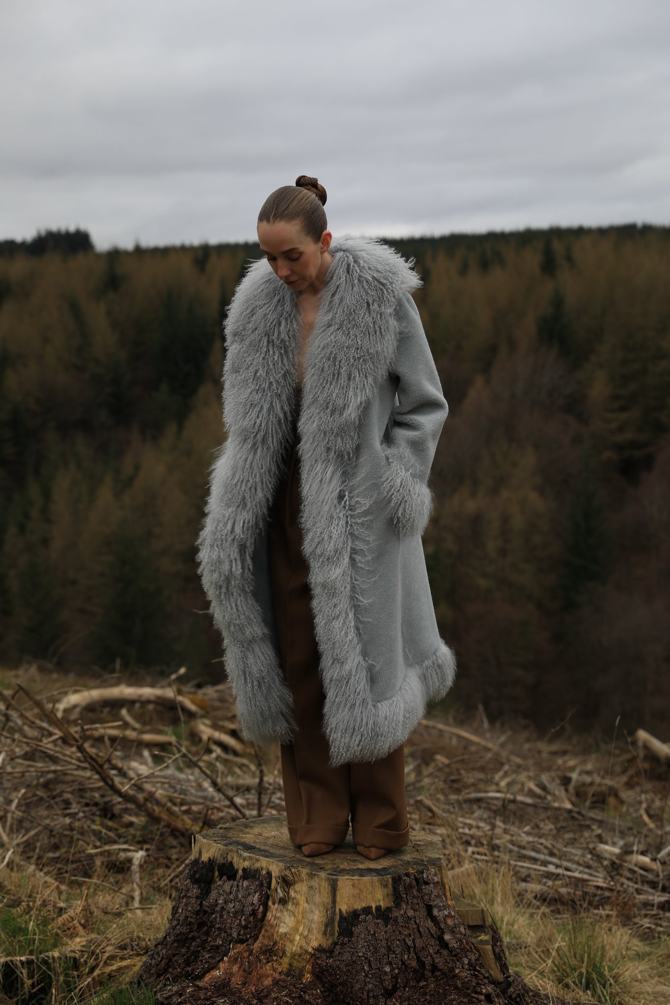 Josephine Jones bestselling long genuine shearling coat in grey, featuring exquisite Mongolian fur trims. Elevate your winter style with this luxurious outerwear essential.