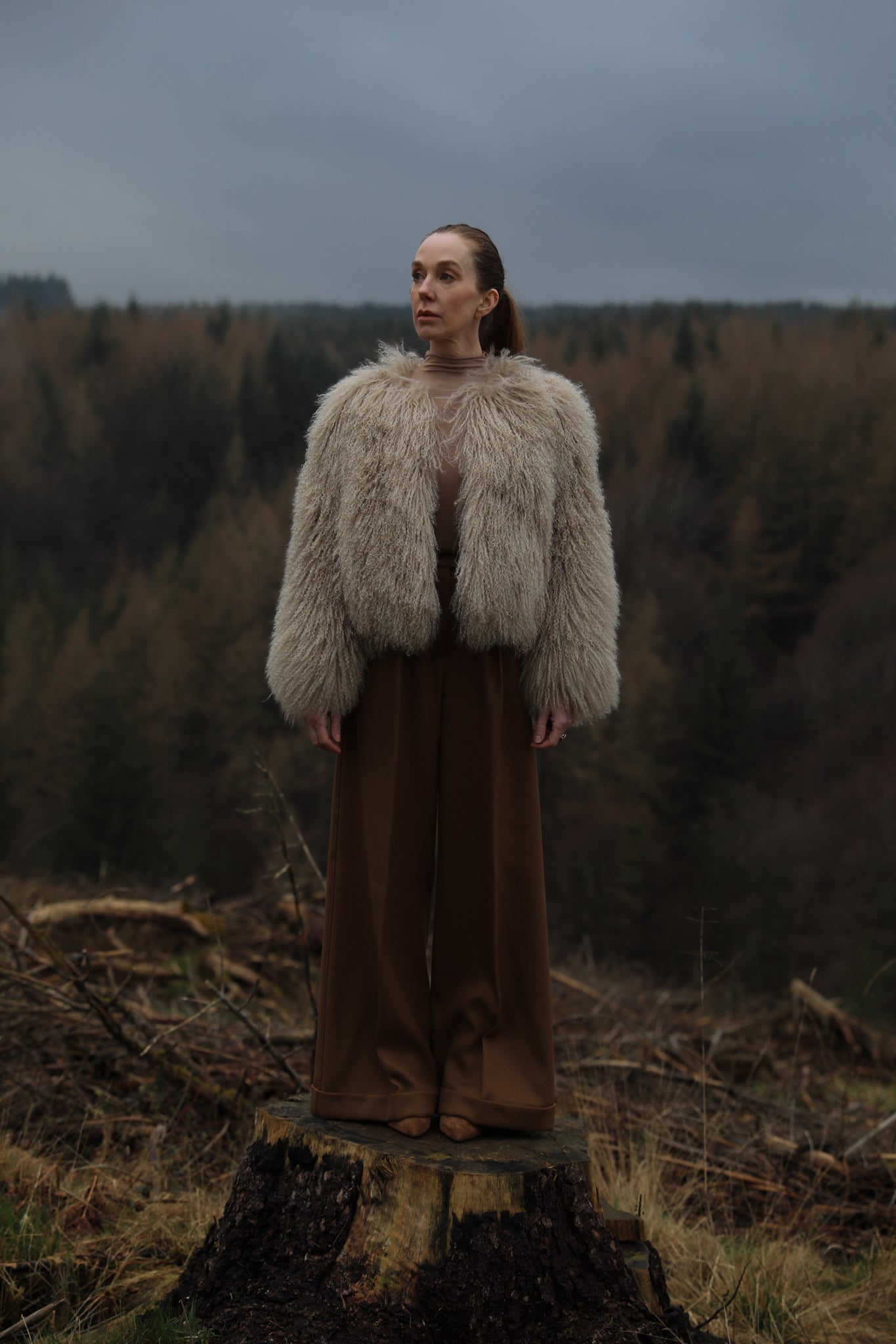 A sophisticated beige Mongolian fur coat from Josephine Jones, exuding elegance and warmth, perfect for adding a touch of luxury to any outfit.