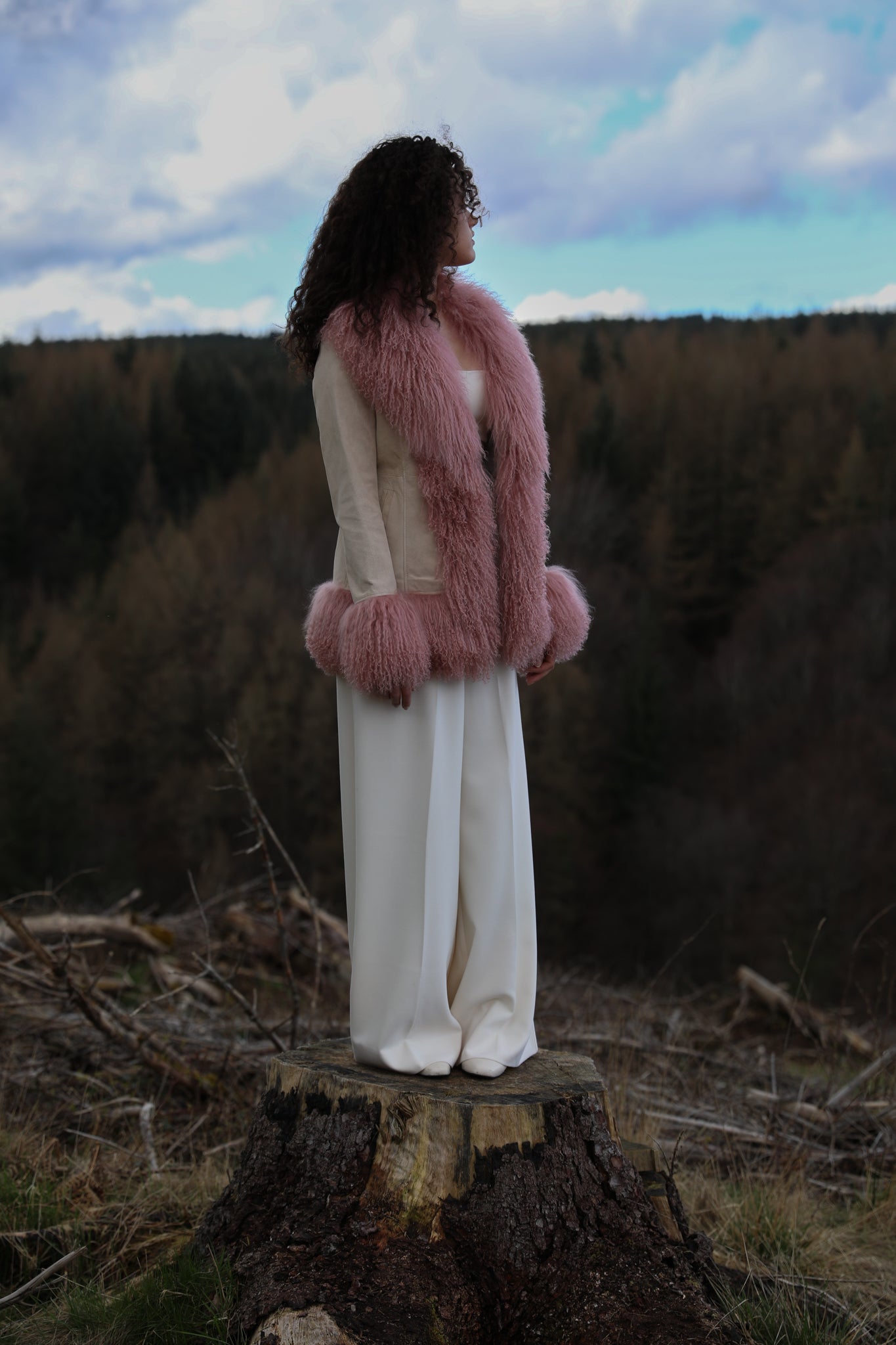 Ivory suede afghan-style jacket with blush Mongolian fur trims by Josephine Jones, epitomizing classic Penny Lane style. Luxurious genuine suede adds texture and sophistication to your wardrobe.