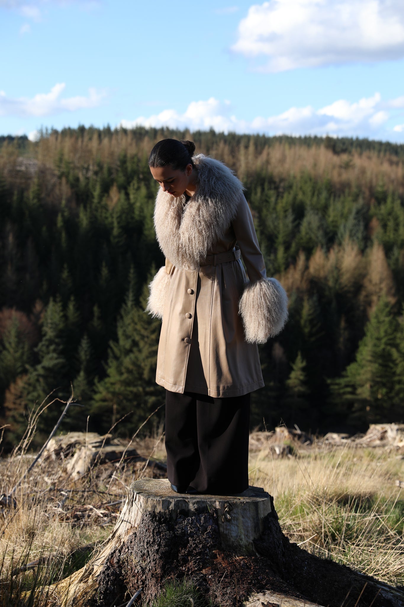 Josephine Jones beige trench coat with Mongolian collar and cuffs, crafted from genuine leather. Elevate your style with this luxurious outerwear piece.'