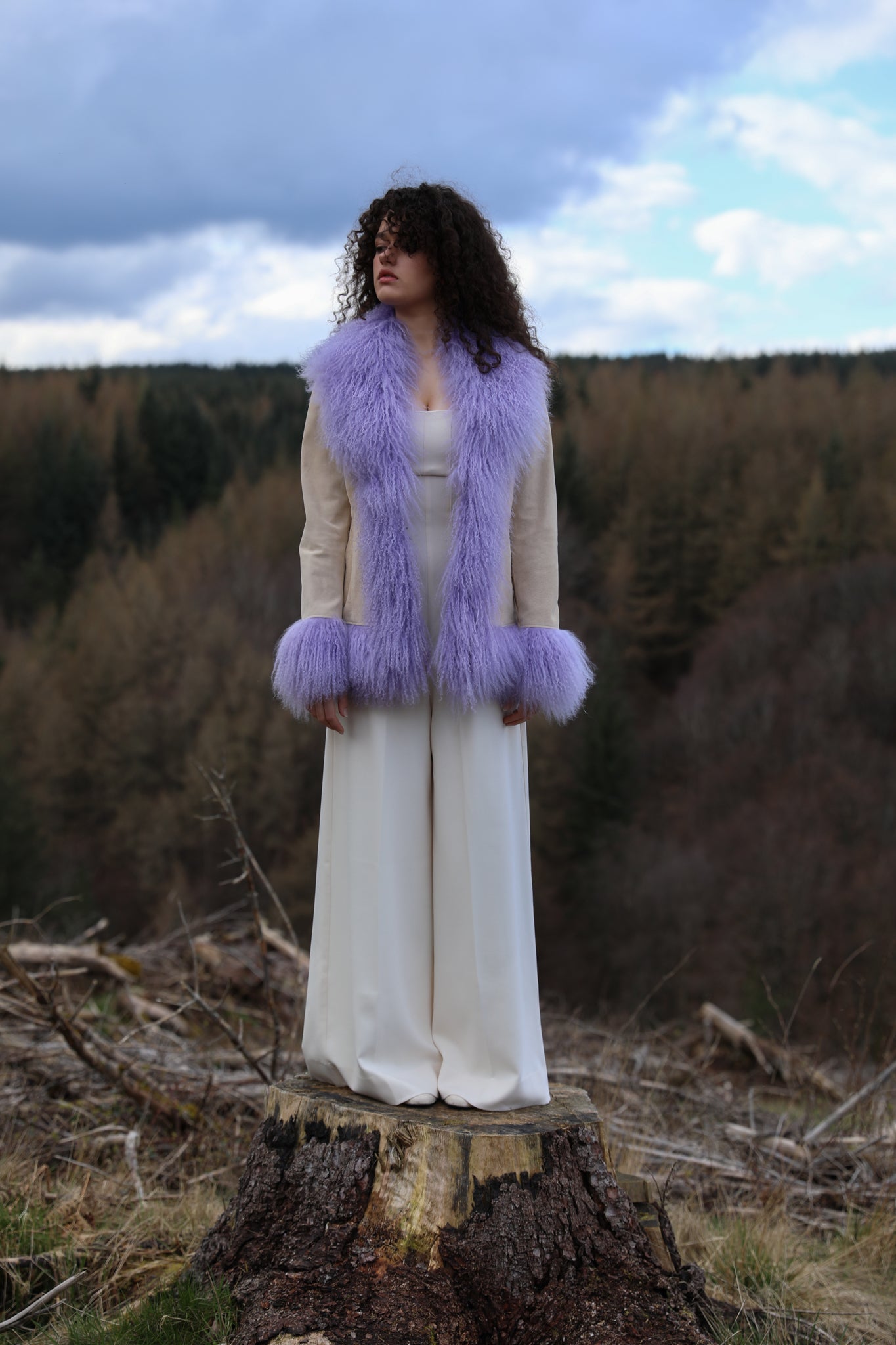 Ivory suede afghan penny lane jacket with lavender Mongolian fur trims, a timeless statement piece from Josephine Jones' collection. Luxurious, genuine suede construction adds texture and sophistication to any ensemble.