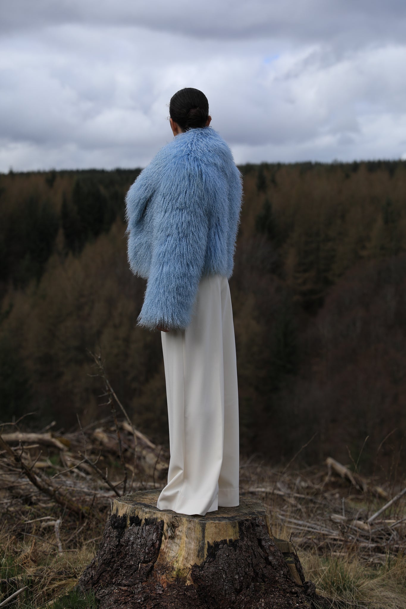 A stunning blue voluminous collar Mongolian fur coat by Josephine Jones, a timeless staple piece exuding elegance and luxury.