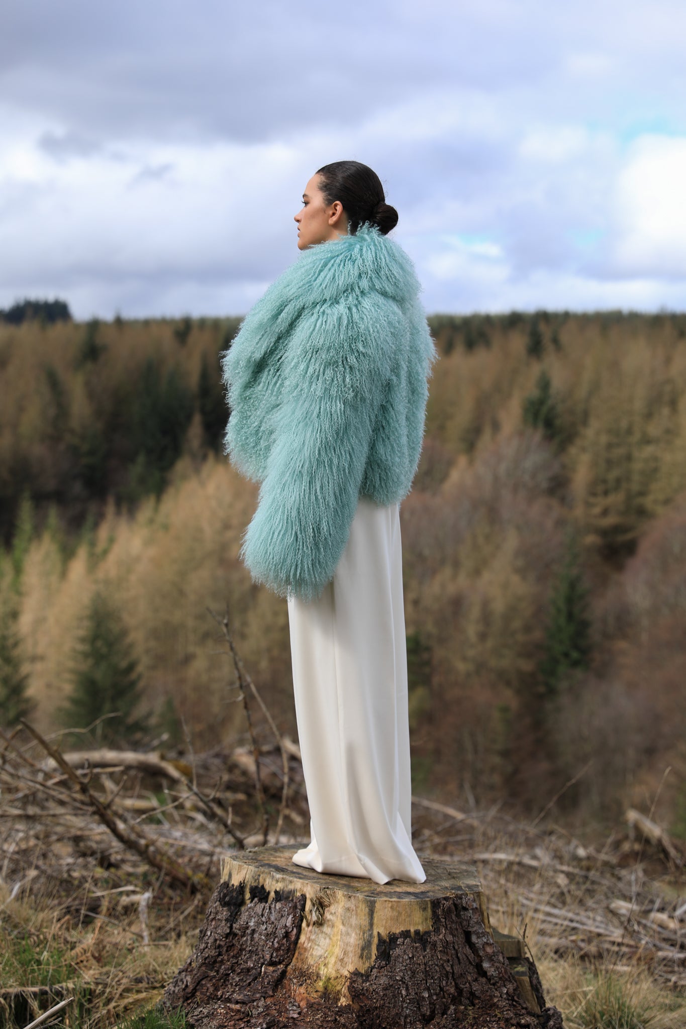 Josephine Jones' iconic mint voluminous collar Mongolian fur coat, a classic staple piece for luxurious winter fashion.