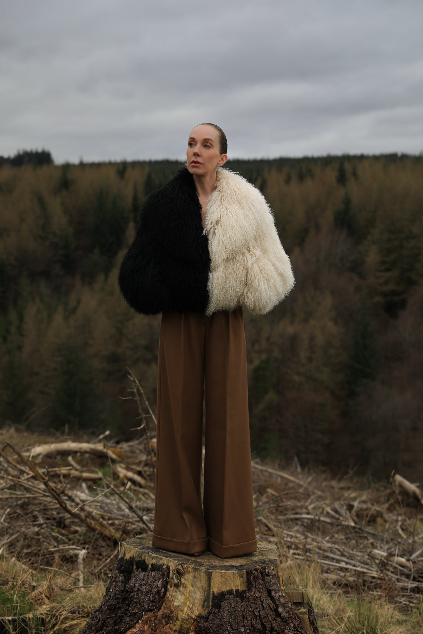 Josephine Jones' iconic Mongolian fur coat, showcasing a voluminous collar with a striking half-ivory, half-black design. A timeless statement piece for any wardrobe.