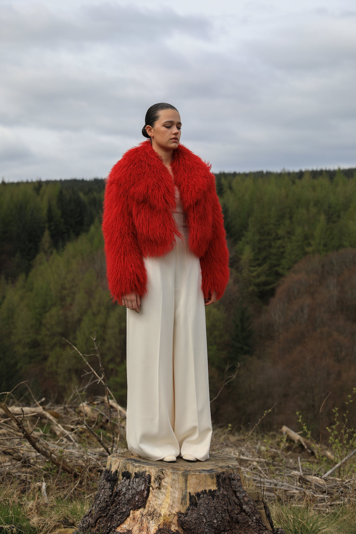 A striking red voluminous collar Mongolian fur coat from Josephine Jones, a timeless staple piece exuding elegance and luxury.