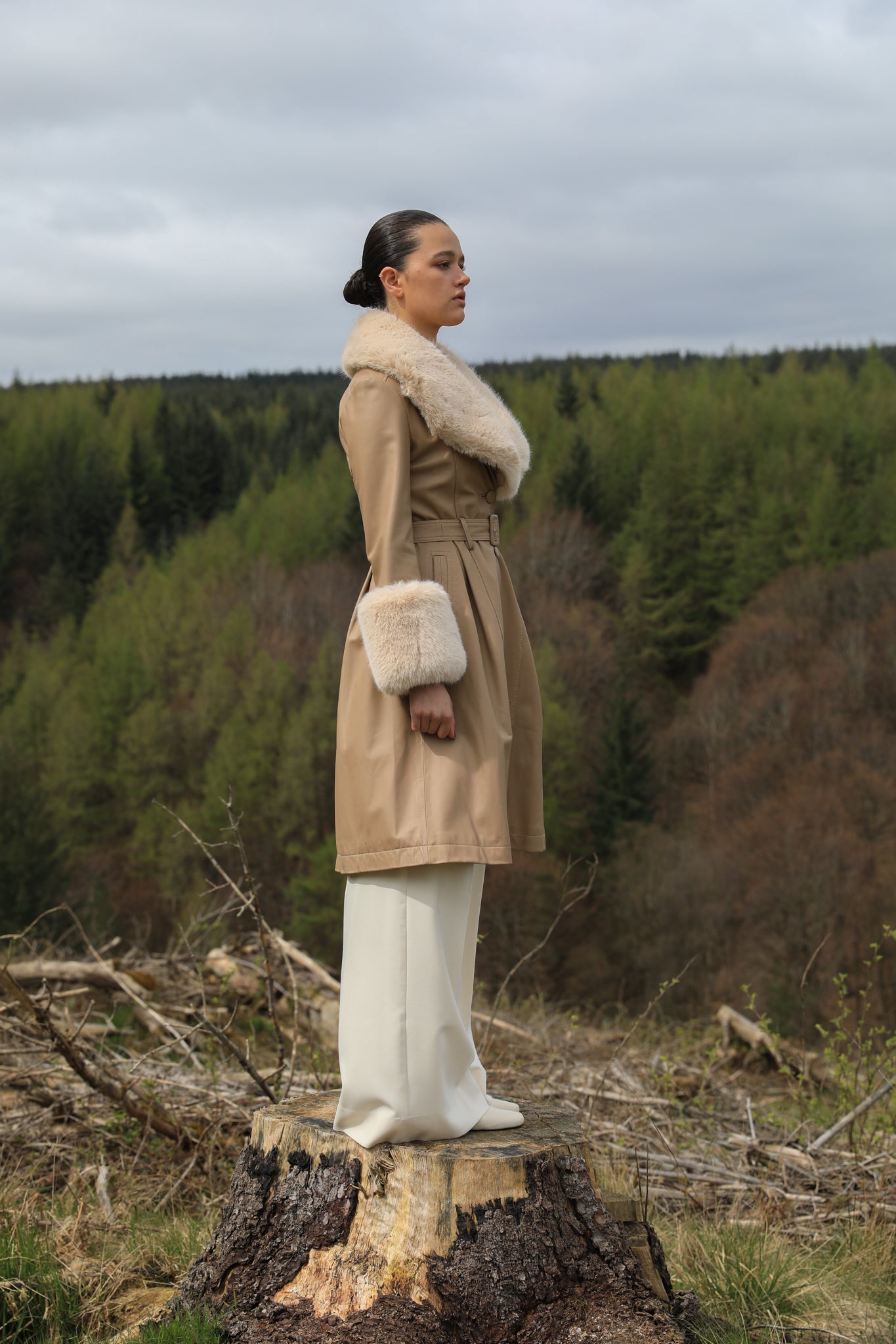 Josephine Jones' genuine leather beige trench coat featuring a faux fur collar and cuffs, exuding timeless elegance and sophisticated style.